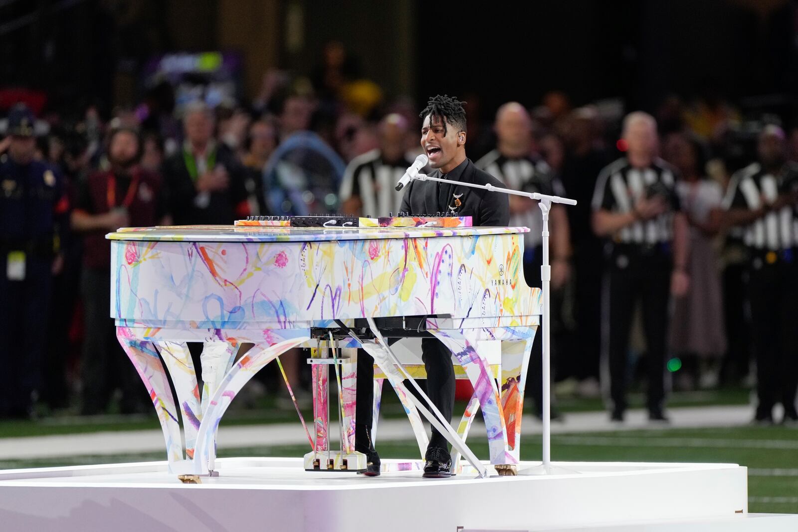 Jon Batiste performs the national anthem before the NFL Super Bowl 59 football game between the Kansas City Chiefs and the Philadelphia Eagles, Sunday, Feb. 9, 2025, in New Orleans. (AP Photo/Stephanie Scarbrough)