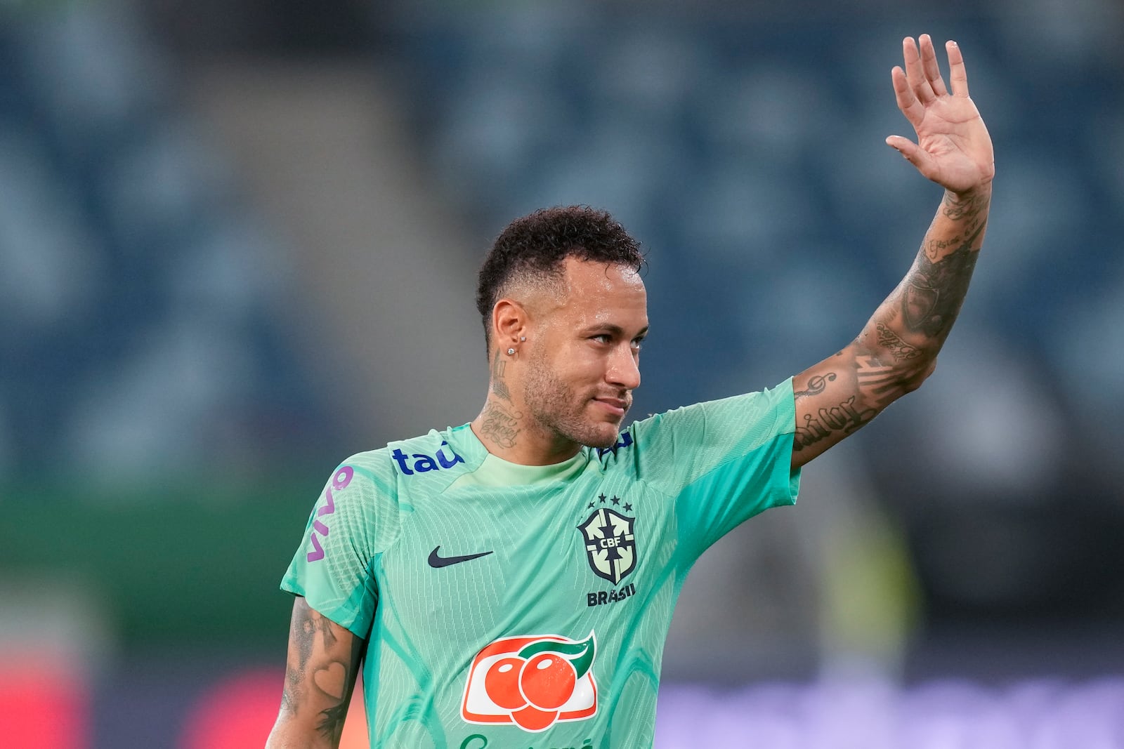 FILE - Brazil's Neymar waves to fans during a training session in Cuiaba, Brazil, Tuesday, Oct. 10, 2023. (AP Photo/Andre Penner, File)