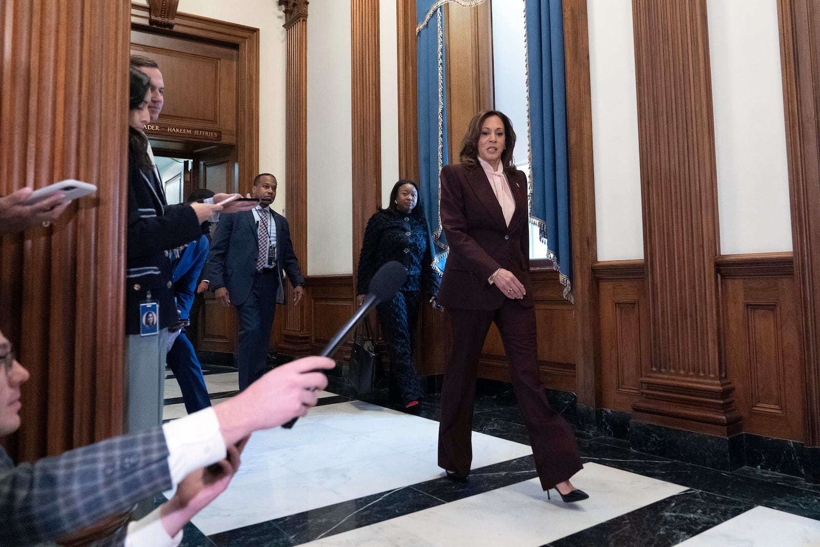 Vice President Kamala Harris walks to speak with reporters after presiding over a joint session of congress to confirm the Electoral College votes at the Capitol, Monday, Jan. 6, 2025, in Washington. (AP Photo/Jose Luis Magana)