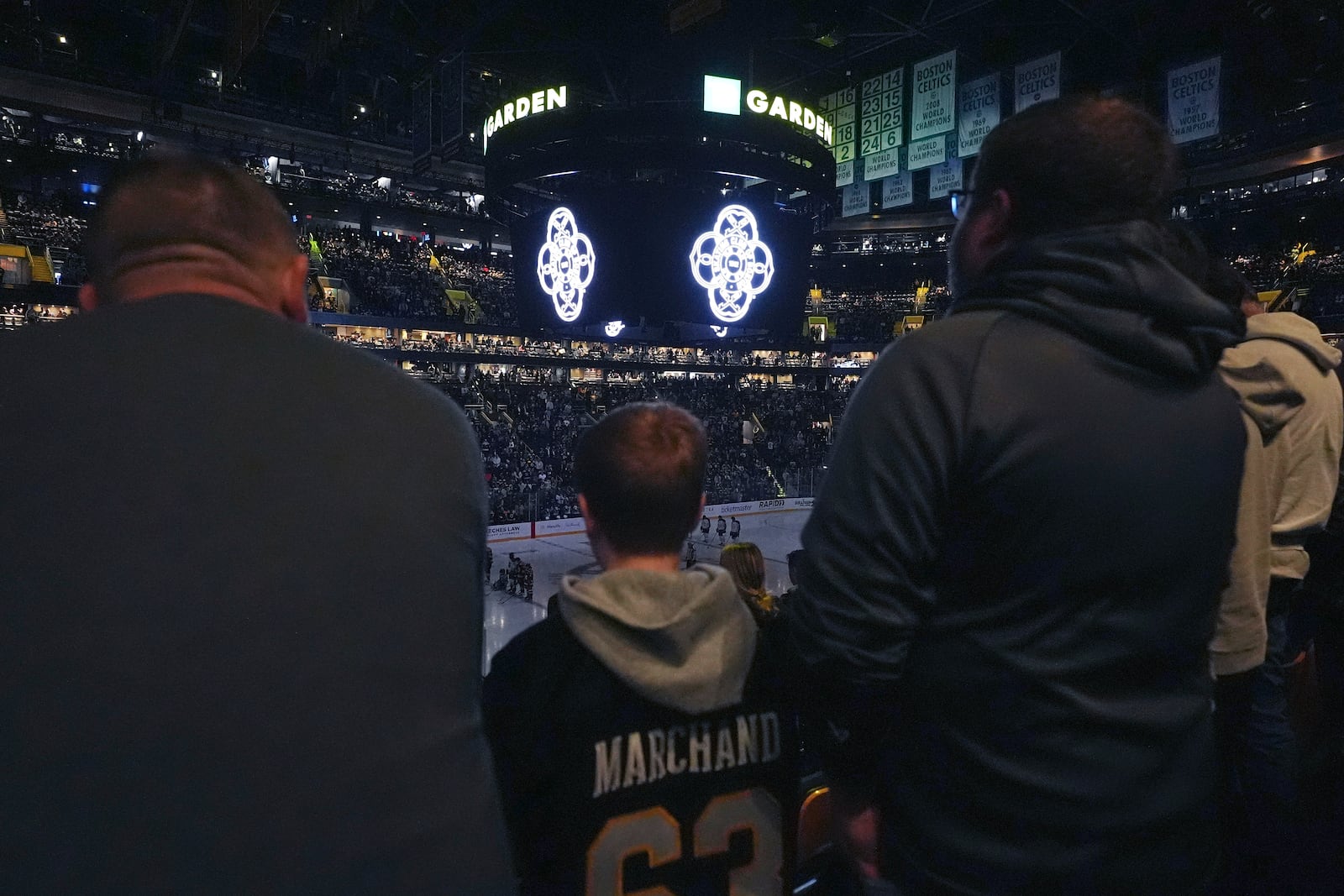 Members of the Skating Club of Boston community, athletes, coaches and family who were killed when an American Airlines flight collided with an Army helicopter Wednesday, Jan. 29, 2025, and crashed into the Potomac River in Washington, are honored prior to an NHL hockey game between the Boston Bruins and Winnipeg Jets, Thursday, Jan. 30, in Boston. (AP Photo/Charles Krupa)