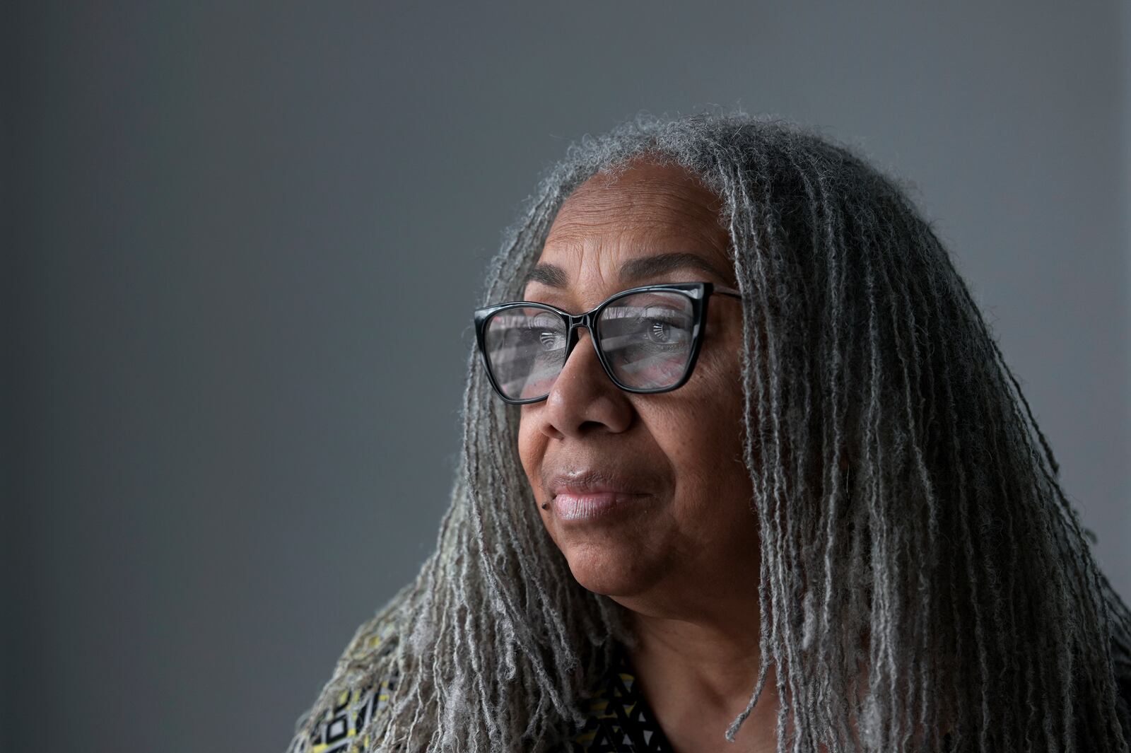 Leslie Knox looks outside in her home Wednesday, Feb. 5, 2025, in Hamtramck, Mich. (AP Photo/Paul Sancya)