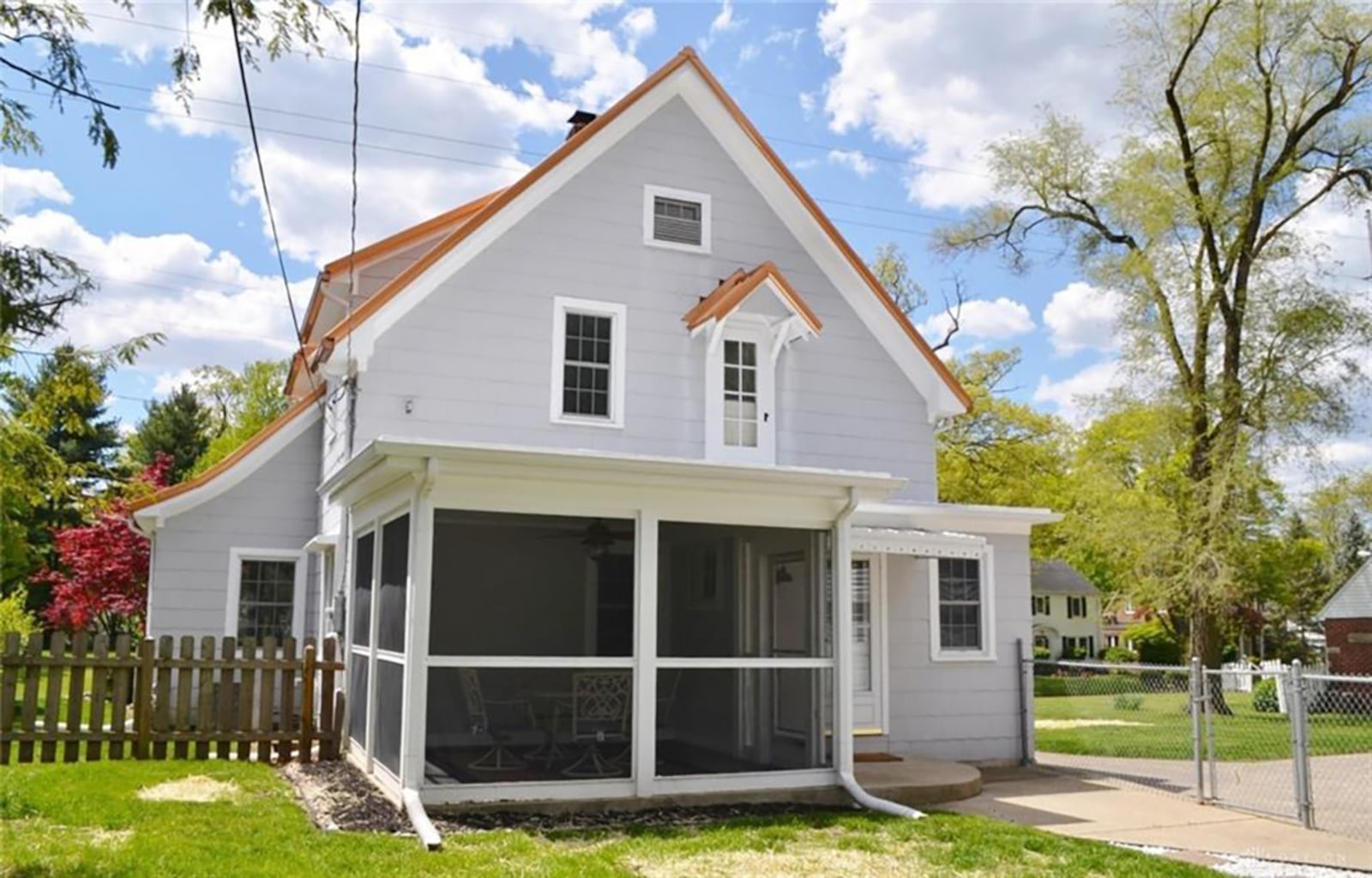 A screened porch overlooks the fenced-in backyard. The home comes with an additional parcel of land. CONTRIBUTED PHOTO