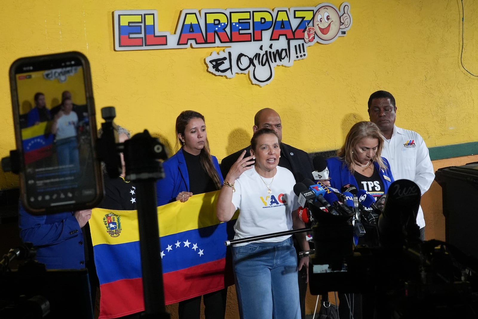 Adelys Ferro, executive director of grassroots organization the Venezuelan American Caucus, speaks during a press conference by Venezuelan community leaders to denounce an end to the protections that shielded hundreds of thousands of Venezuelans from deportation, Monday, Feb. 3, 2025, at El Arepazo restaurant in Doral, Fla. (AP Photo/Rebecca Blackwell)