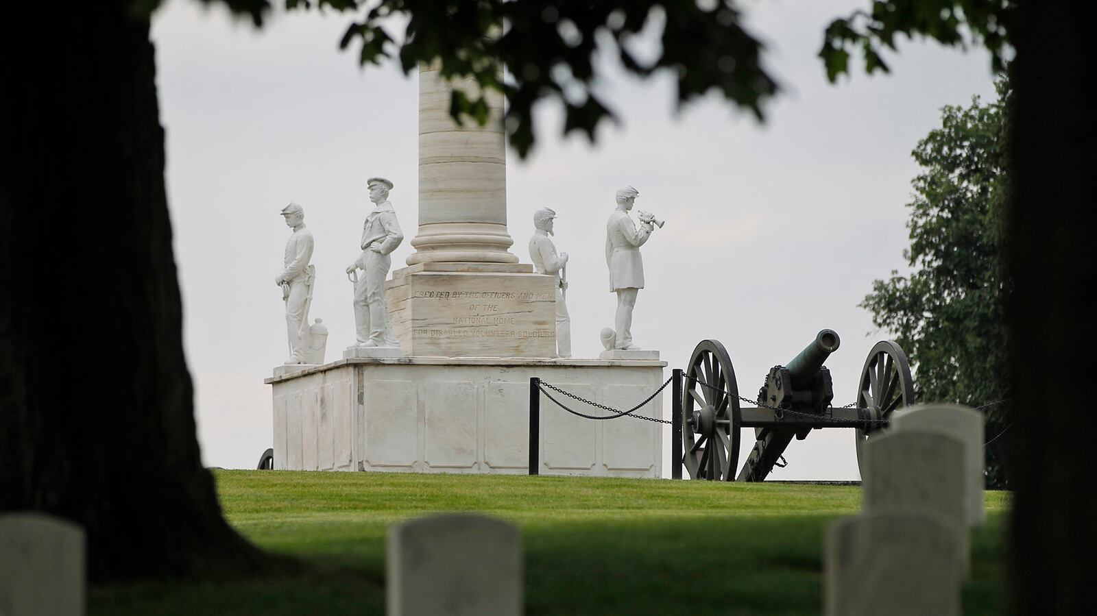 The Dayton Soldiers' Monument sits atop a hill at the center of the Dayton National Cemetery landscape. The cornerstone was laid in 1873, and it was completed in 1877.  The structure is composed of a 30-foot marble column on a granite base.  At the corners of the base stand four figures representing the Infantry, Cavalry, Artillery and Navy.  TY GREENLEES / STAFF