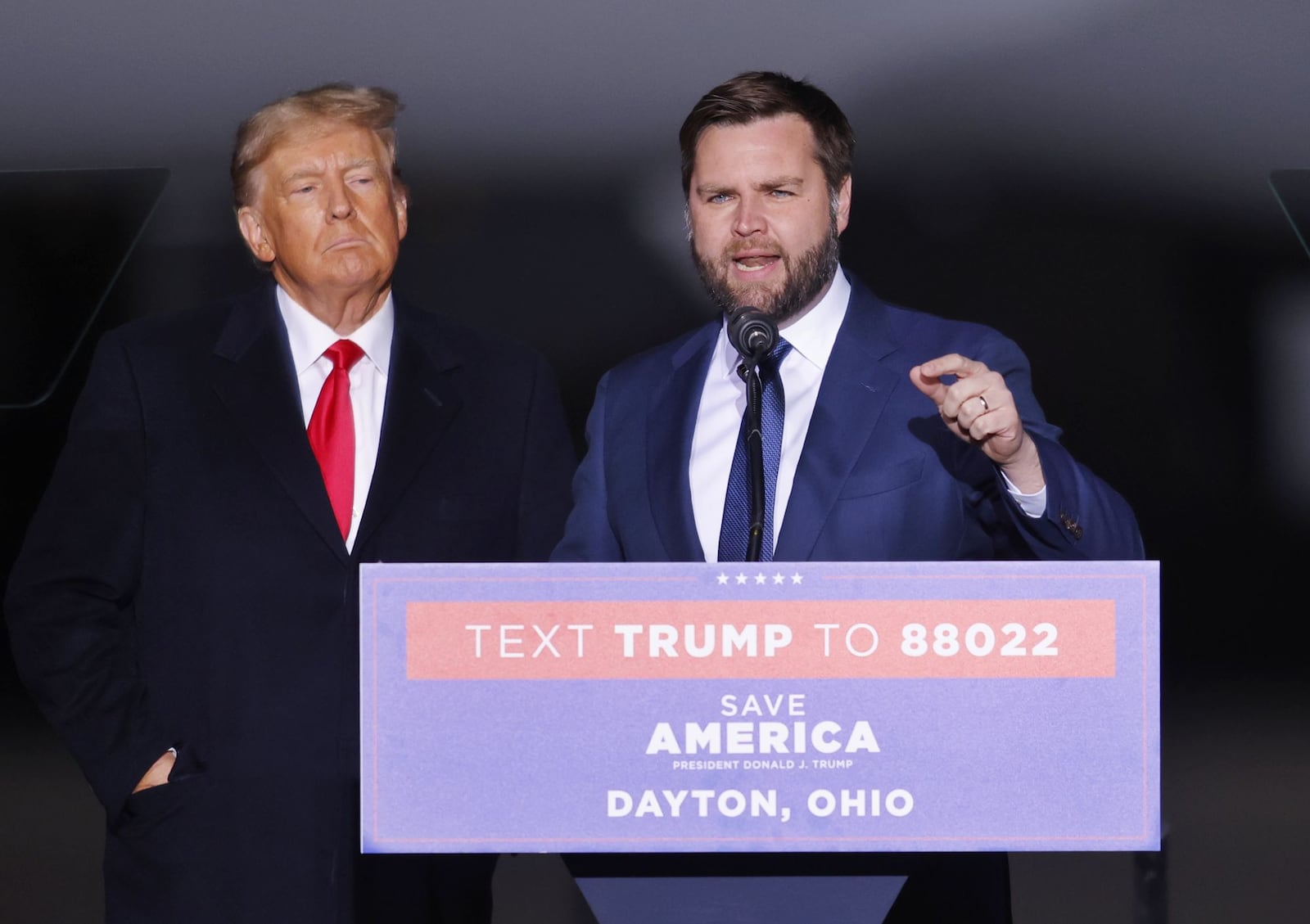 Donald Trump, left, brought J.D. Vance up to speak during a rally Monday, Nov. 7, 2022 at Dayton International Airport. NICK GRAHAM/STAFF