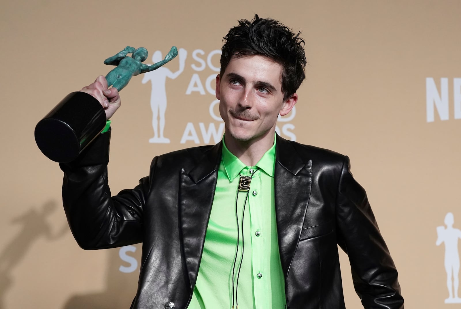 Timothee Chalamet poses in the press room with the award for outstanding performance by a male actor in a leading role for "A Complete Unknown" during the 31st annual Screen Actors Guild Awards on Sunday, Feb. 23, 2025, at the Shrine Auditorium in Los Angeles. (Photo by Jordan Strauss/Invision/AP)