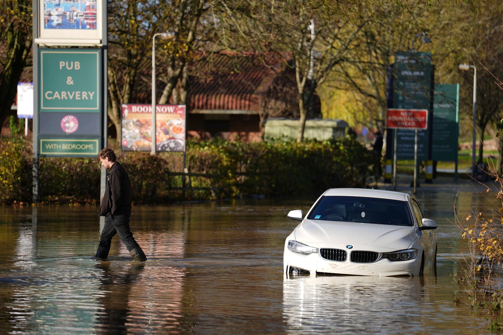 A stranded car in flood water at the Billing Aquadrome as Storm Bert continues to cause disruption, in Northampton, England, Monday, Nov. 25, 2024. (Jordan Pettitt/PA via AP)