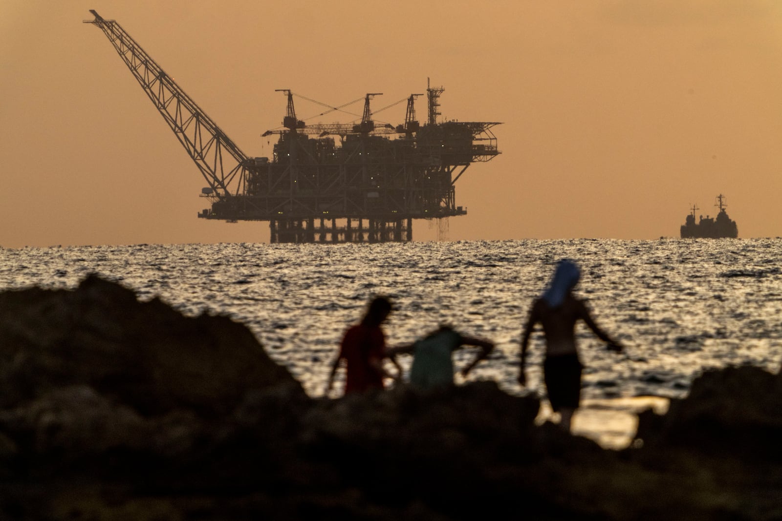 FILE - An oil platform in Israel's offshore Leviathan gas field is seen while an Israeli navy vessel patrols the Mediterranean Sea, Israel, on Sept. 20, 2024. (AP Photo/Ariel Schalit, File)