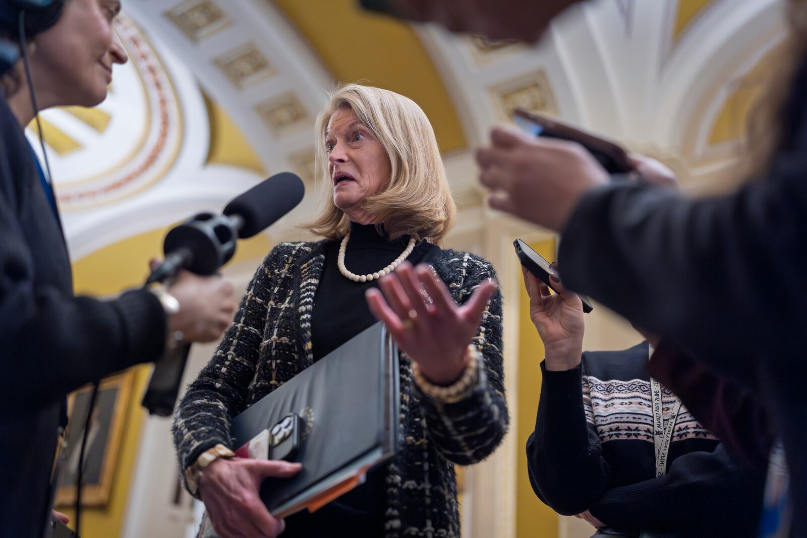 Sen. Lisa Murkowski, R-Alaska, speaks with reporters outside the Senate chamber at the Capitol in Washington, Wednesday, Jan. 22, 2025. (AP Photo/J. Scott Applewhite)