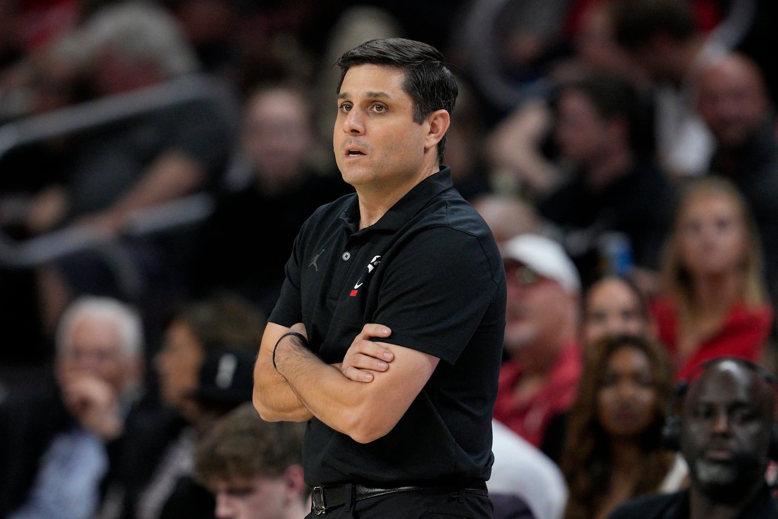 Cincinnati head coach Wes Miller stands by the bench during the first half of an NCAA college basketball game against Arkansas-Pine Bluff, Monday, Nov. 4, 2024, in Cincinnati. (AP Photo/Jeff Dean)