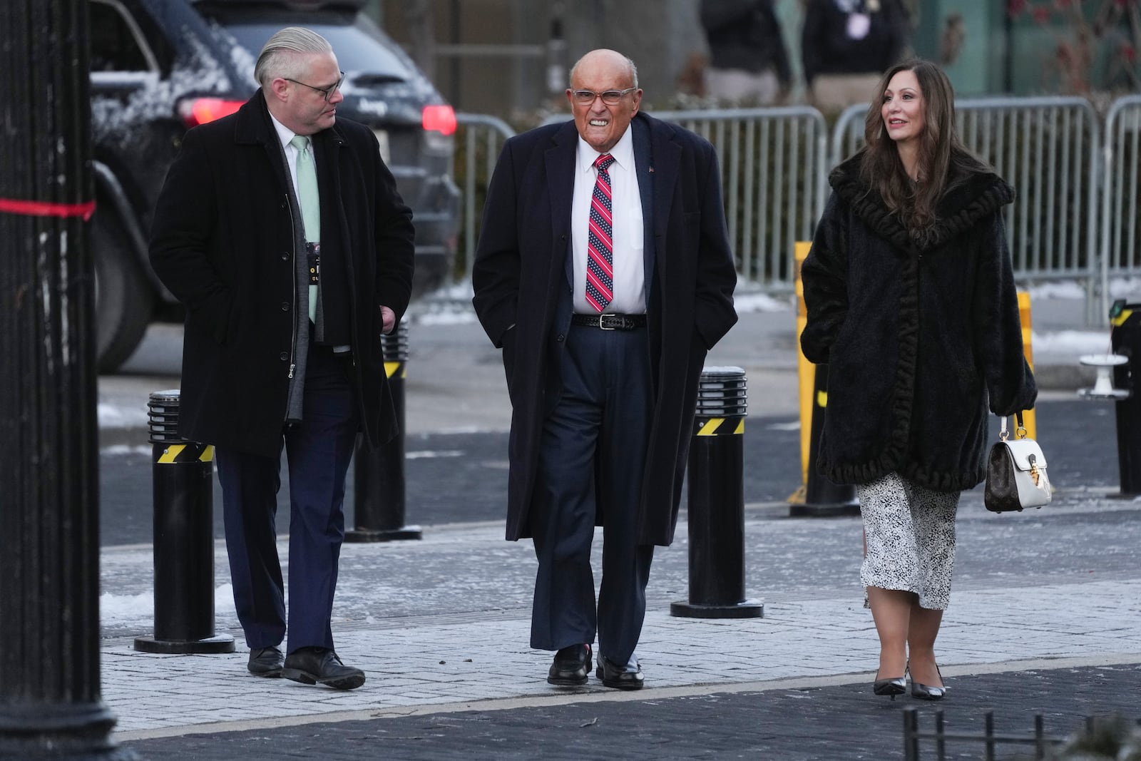 Rudy Giuliani, center arrives for a church service to be attended by President-elect Donald Trump and his wife Melania at St. John's Episcopal Church across from the White House in Washington, Monday, Jan. 20, 2025, on Donald Trump's inauguration day. (AP Photo/Matt Rourke)