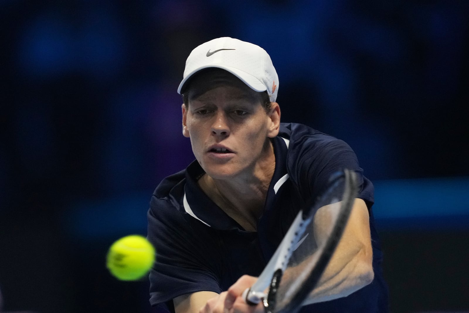 Italy's Jannik Sinner returns the ball to United States' Taylor Fritz during their singles tennis match of the ATP World Tour Finals at the Inalpi Arena, in Turin, Italy, Tuesday, Nov. 12, 2024. (AP Photo/Antonio Calanni)