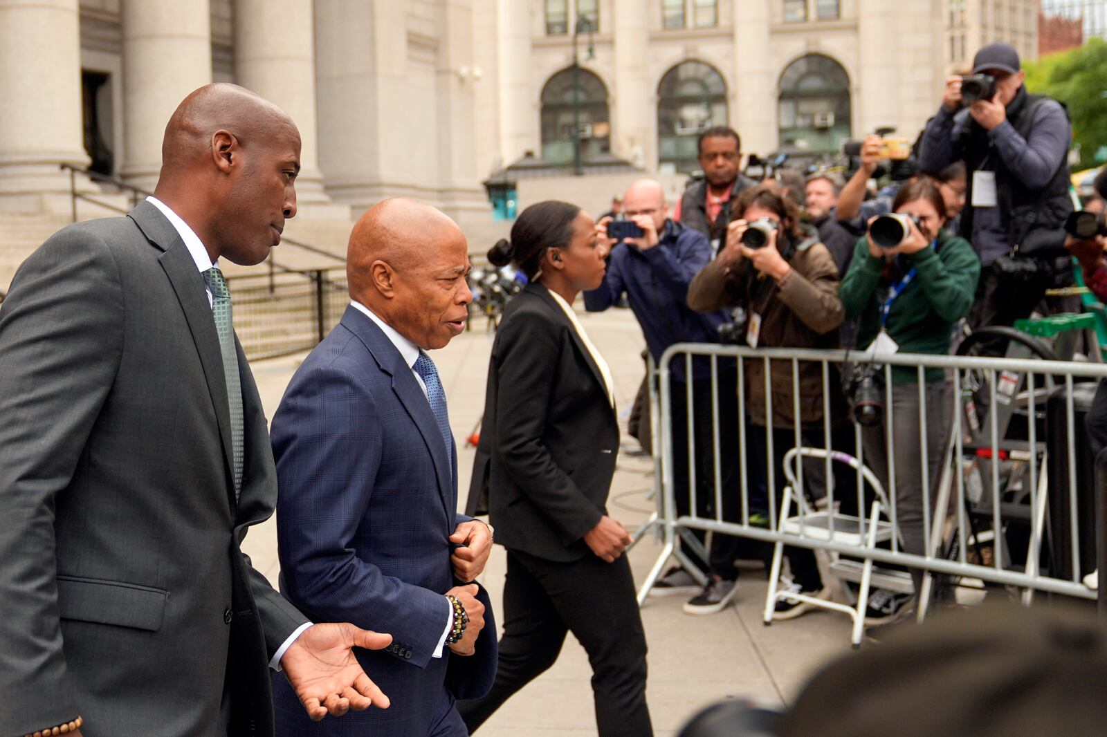 FILE - New York City Mayor Eric Adams, second from left, leaves the courthouse in New York, Oct. 2, 2024. (AP Photo/Seth Wenig, File)