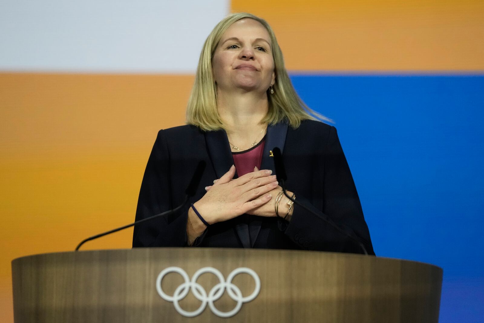 Kirsty Coventry reacts after she was announced as the new IOC President at the International Olympic Committee 144th session in Costa Navarino, western Greece, Thursday, March 20, 2025. (AP Photo/Thanassis Stavrakis)