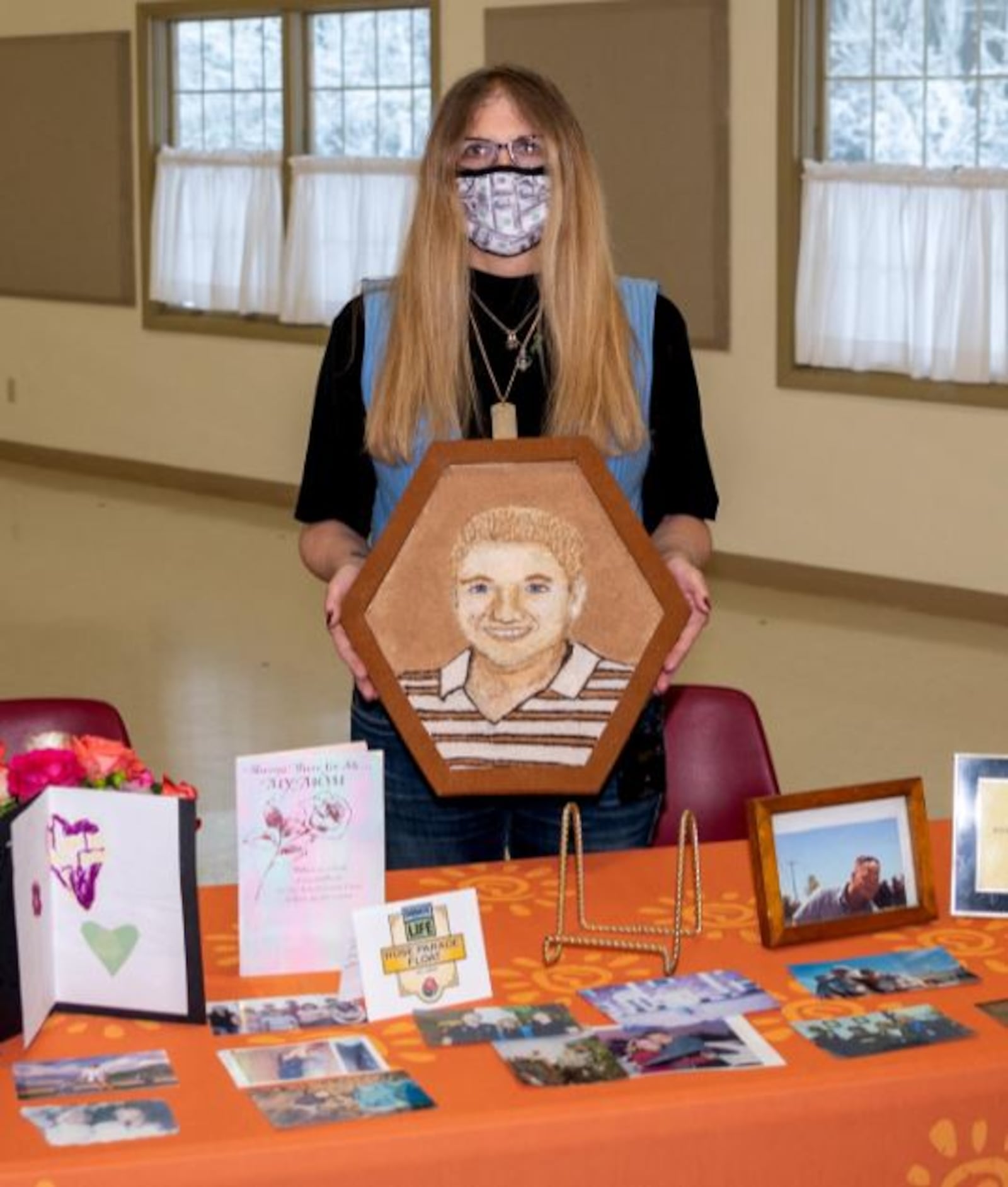 Carmela Wiant holds a floragraph of her son, David Money. Submitted photo by John Coffman.