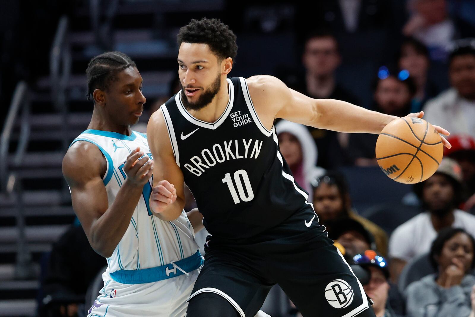 Brooklyn Nets guard Ben Simmons (10) drives into Charlotte Hornets forward Moussa Diabate during the first half of an NBA basketball game in Charlotte, N.C., Wednesday, Jan. 29, 2025. (AP Photo/Nell Redmond)