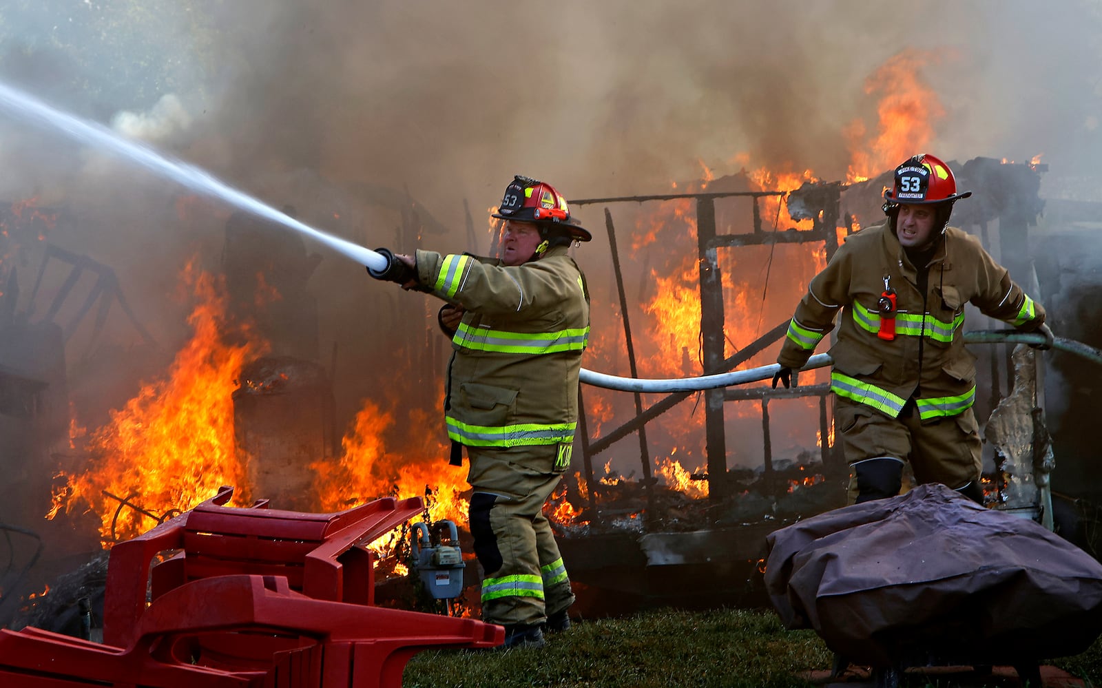 Two mobile homes were destroyed by a fire and fiver others were damaged Wednesday, Sept. 20, 2023, at the Honey Creek Mobile Home Park in Pike Township. Fire crews from six surrounding departments responded to the blaze. BILL LACKEY/STAFF 