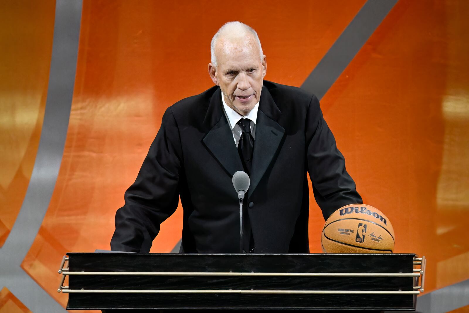 Doug Collins speaks during his enshrinement in the Basketball Hall of Fame, Sunday Oct. 13, 2024, in Springfield, Mass. (AP Photo/Jessica Hill)