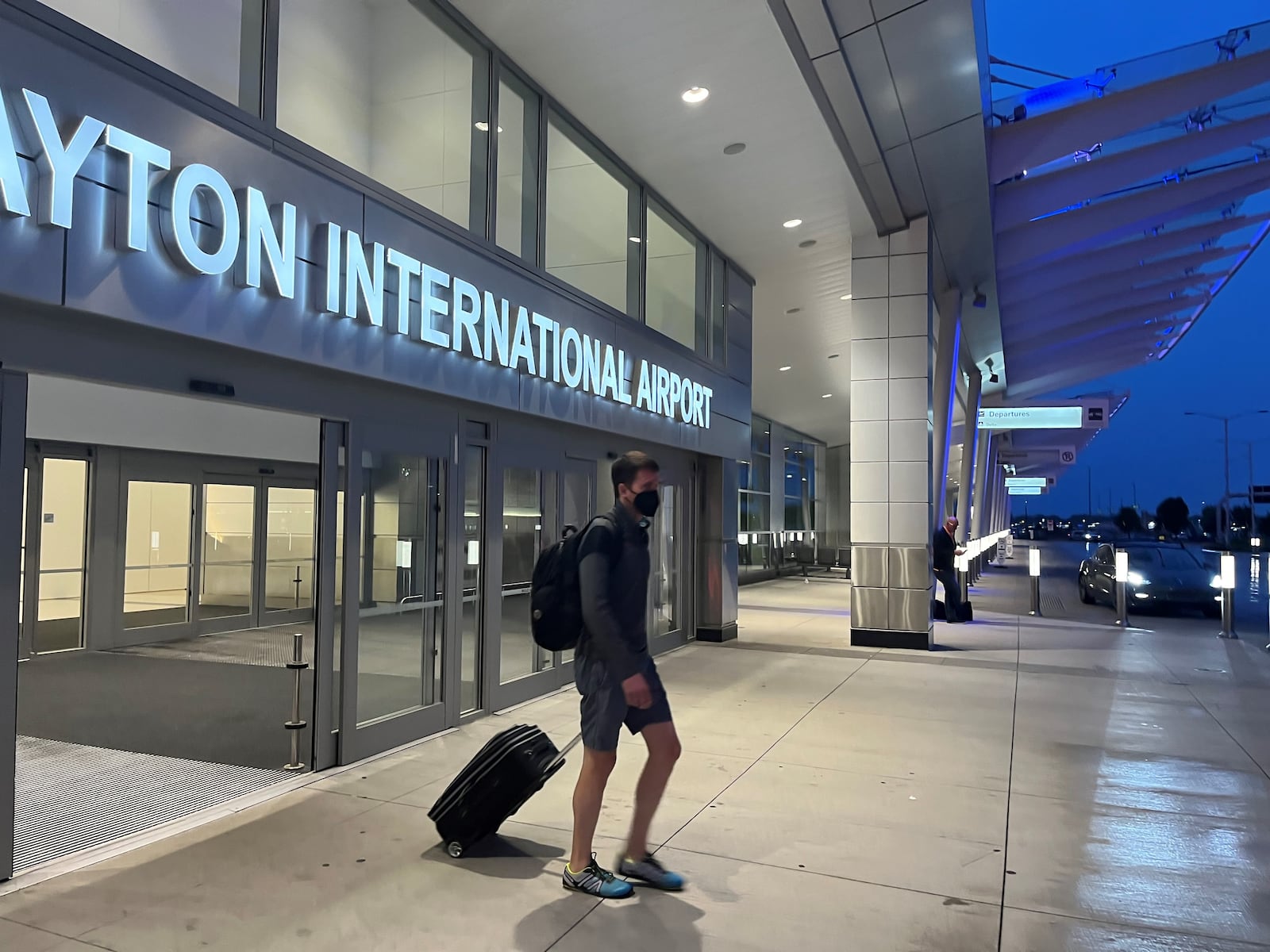 A traveler leaving the Dayton International Airport. CORNELIUS FROLIK / STAFF