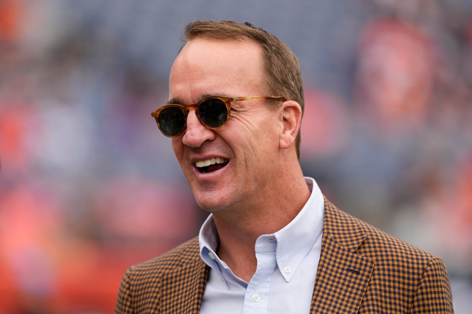 FILE - Hall of Fame quarterback Peyton Manning looks on before an NFL football game between the Denver Broncos and the Carolina Panthers, Sunday, Oct. 27, 2024, in Denver. (AP Photo/Jack Dempsey, File)