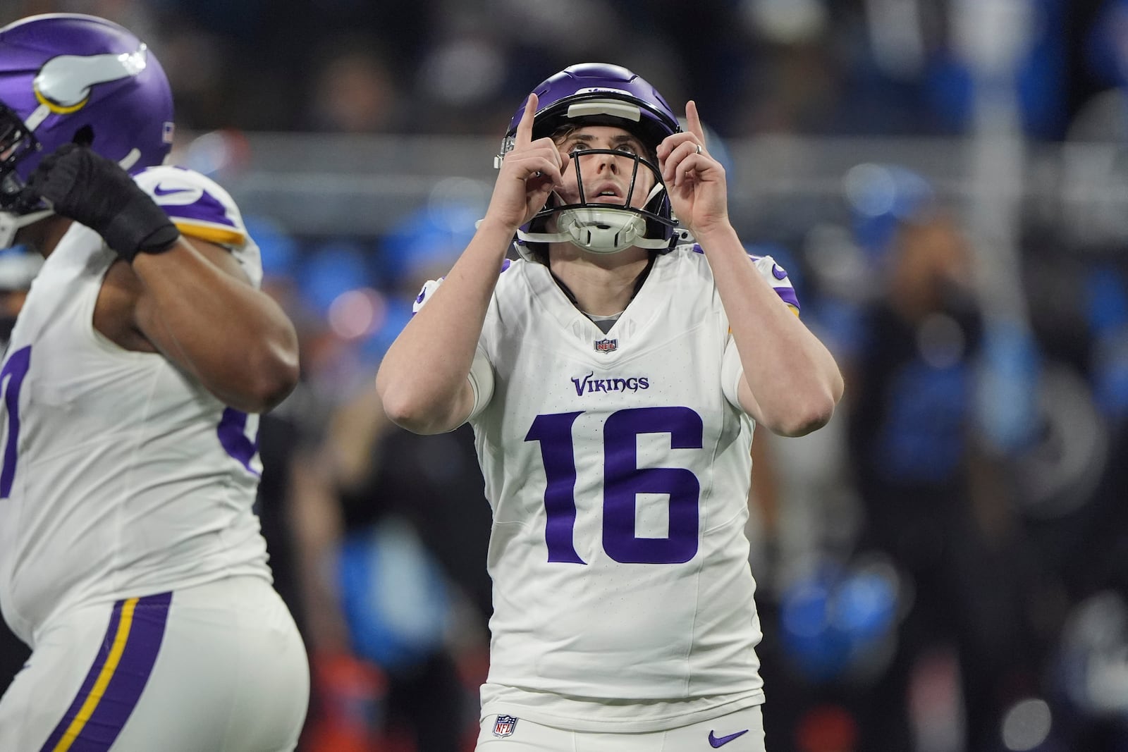 Minnesota Vikings place kicker Will Reichard (16) reacts after kicking a field goal against the Detroit Lions during the first half of an NFL football game Sunday, Jan. 5, 2025, in Detroit. (AP Photo/Charlie Riedel)