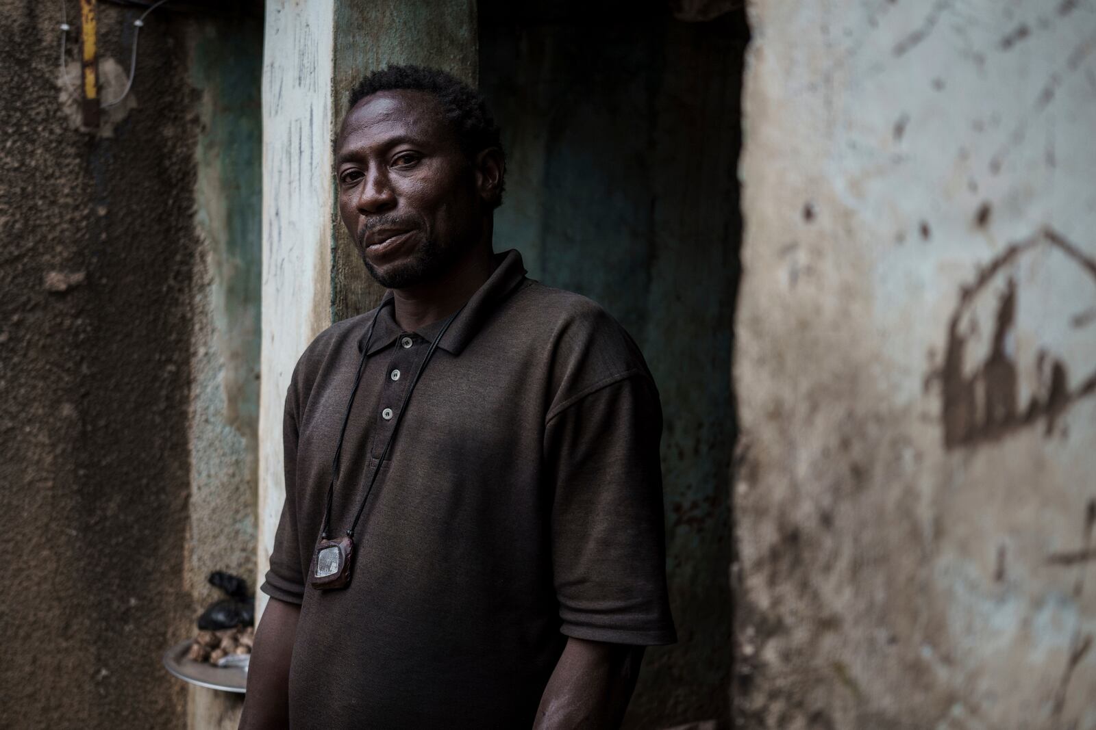 Cheikh Camara, a marabout or influential religious leader, who often prescribes his followers lion skin gris-gris, poses for a portrait in Tambacounda, Senegal on Thursday, Jan. 16, 2025. (AP Photo/Annika Hammerschlag)