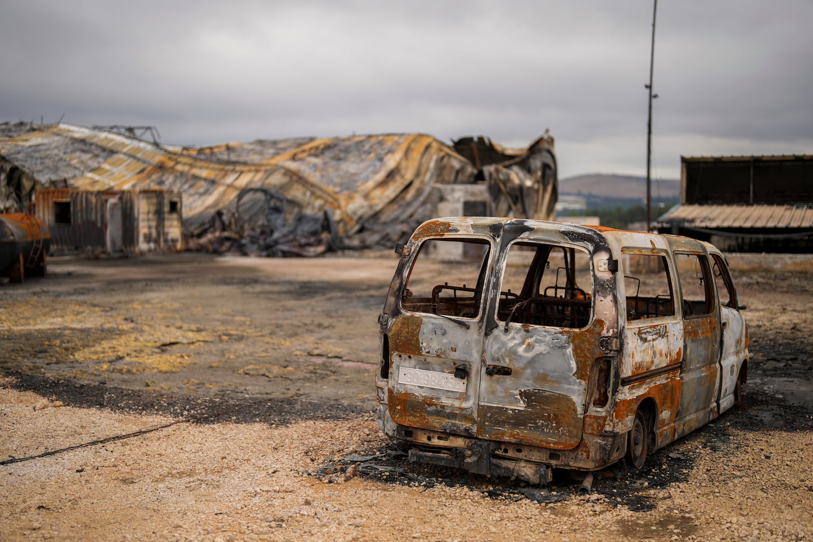 Damage is seen in an animal farm hit by a rocket fired from Lebanon in Avivim, northern Israel, near the border with Lebanon, Wednesday, Nov. 27, 2024. (AP Photo/Francisco Seco)