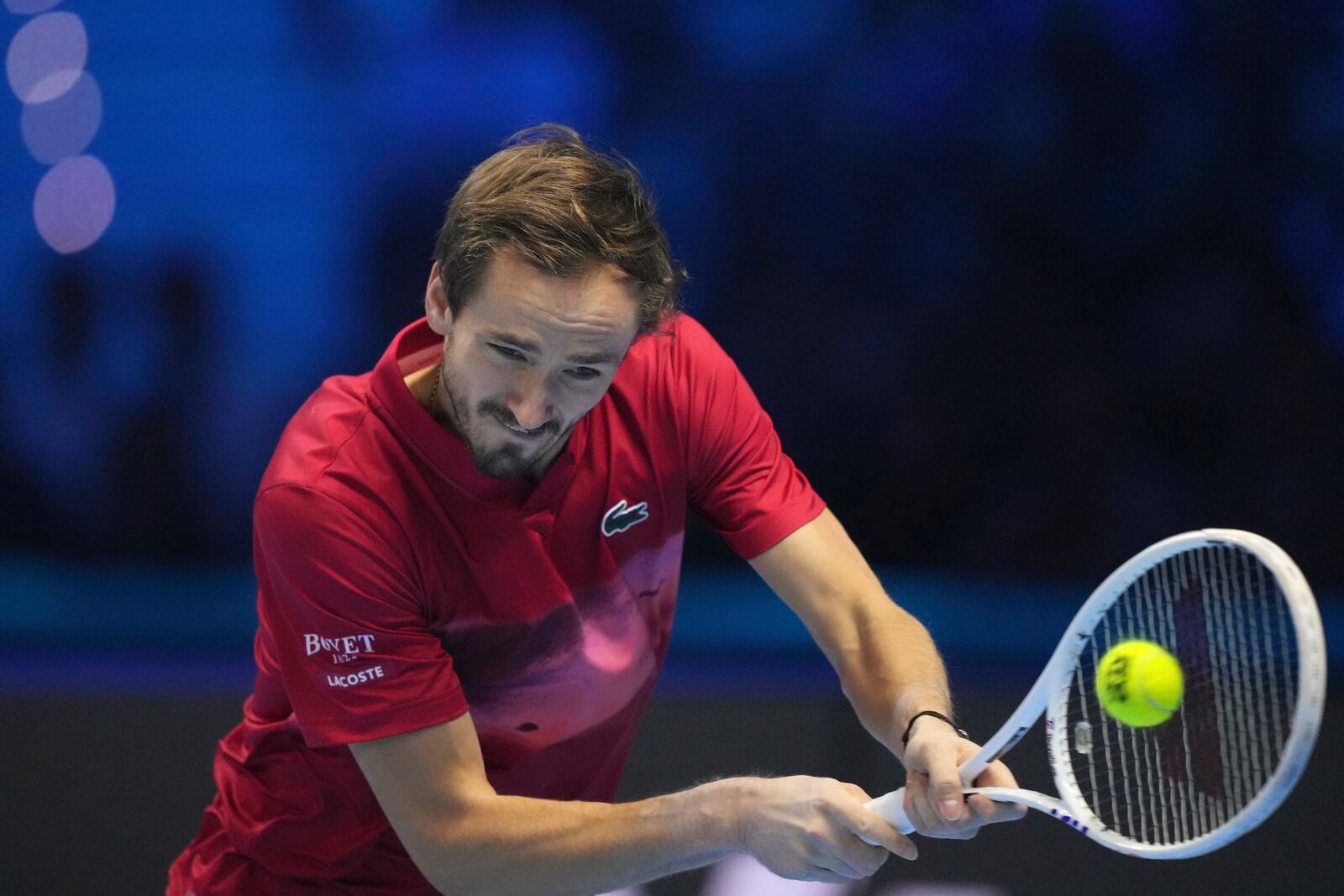 Russia's Daniil Medvedev returns the ball to Australia's Alex de Minaur during their singles tennis match of the ATP World Tour Finals at the Inalpi Arena, in Turin, Italy, Tuesday, Nov. 12, 2024. (AP Photo/Antonio Calanni)