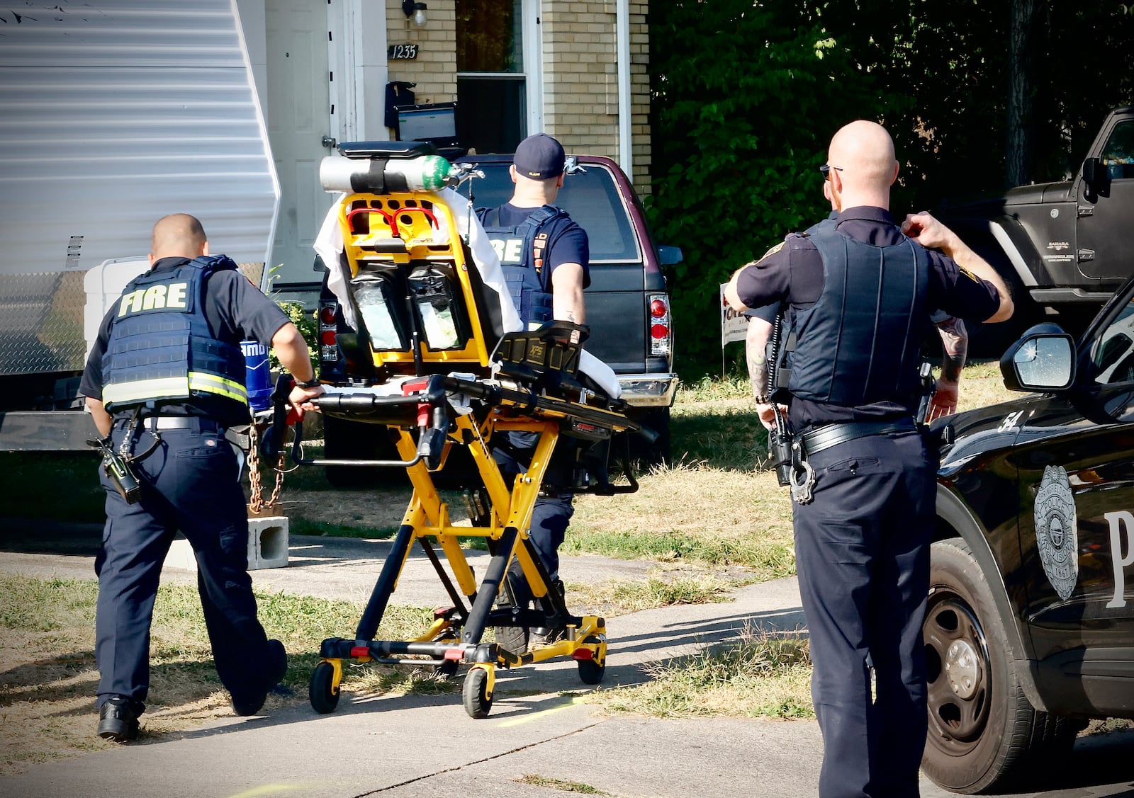 Members of the Springfield police and fire divisions respond to the scene of a shooting on West Cedarview Drive in Springfield, on Saturday morning Sept. 14, 2024. MARSHALL GORBY \STAFF