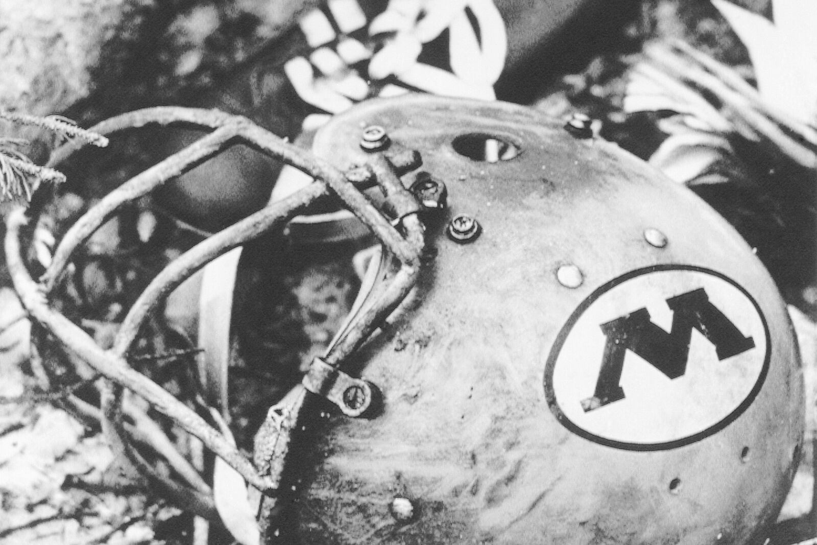 FILE - A charred football helmet, bearing the "W" of Wichita State, hurled from the wreckage of a Martin 4-0-4 airliner near Silver Plume, Colo., as seen on Saturday, Oct. 3, 1970. The crash occurred Oct. 2, about 1:15 pm when the airline crashed into a mountain killing 31 people including members of the Wichita State football team. (AP Photo/Robert D. Scott, File)