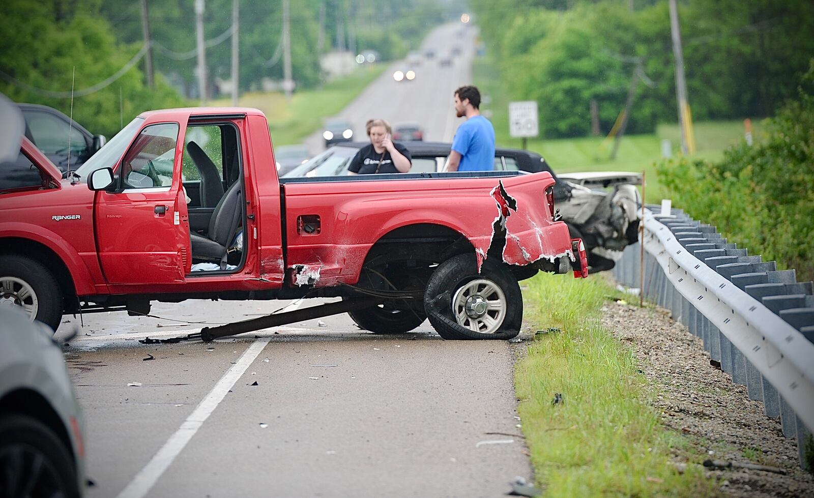 Crews work at a multi-vehicle accident near the intersection of Dayton-Springfield Road and S. Tecumseh Road near Interstate 70 on Tuesday, May 14, 2024. MARSHALL GORBY \STAFF