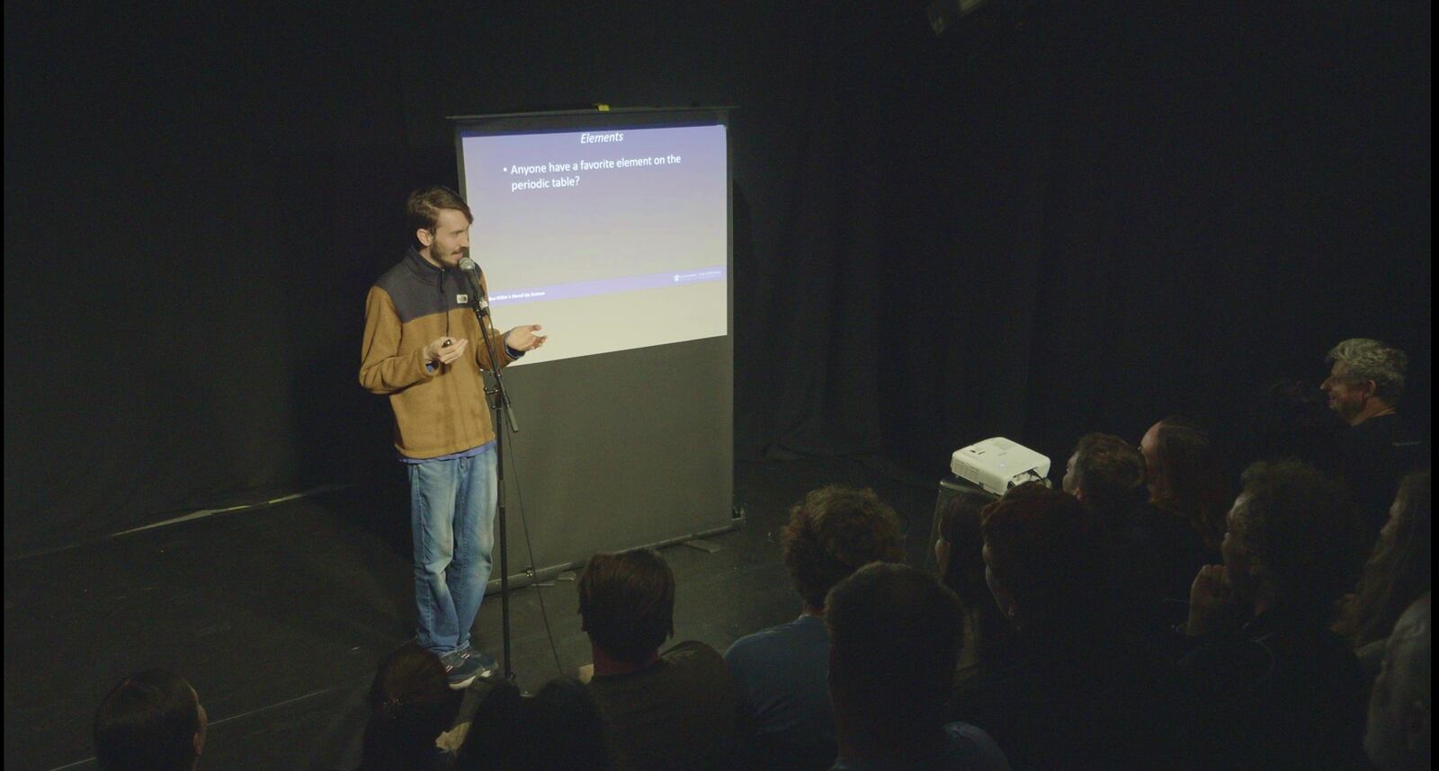 Comedian Ben Miller performing with his visual aids