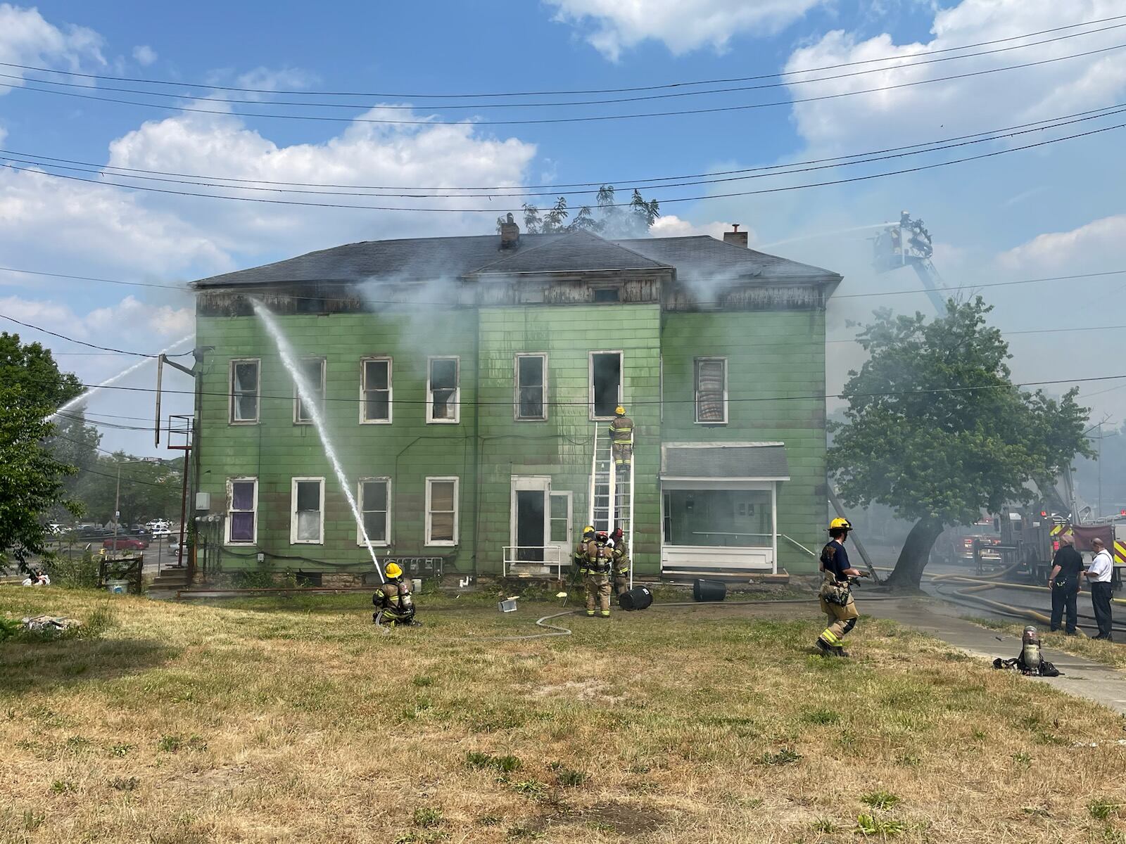 Flames shot through the roof in a house fire on East Mulberry Street in Springfield on Friday, June 9, 2023. BILL LACKEY/STAFF