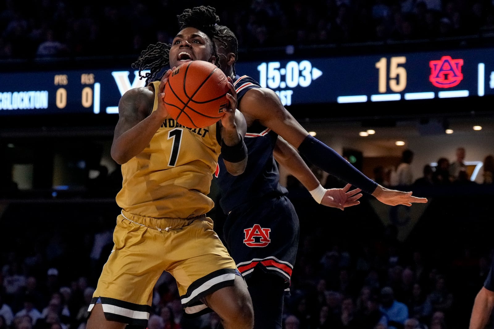 Vanderbilt guard Jason Edwards (1) shoots the ball past an Auburn defender during the first half of an NCAA college basketball game Tuesday, Feb. 11, 2025, in Nashville, Tenn. (AP Photo/George Walker IV)