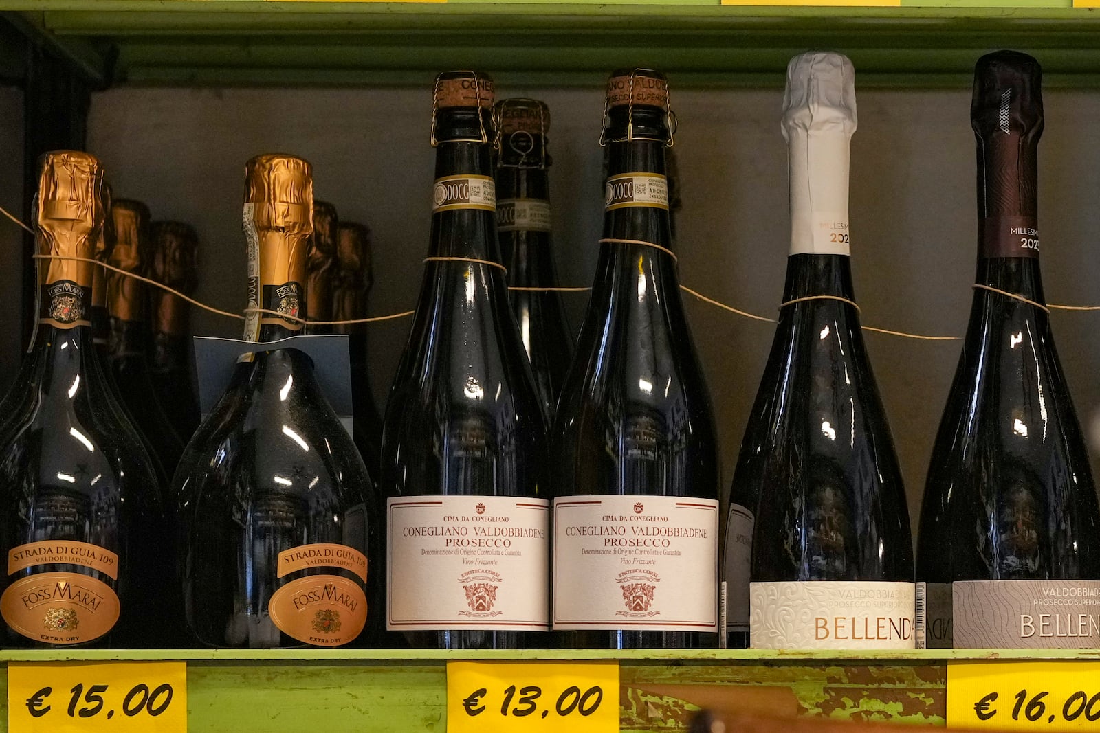 Bottles of Prosecco are lined up on a shelf of a wine shop in Rome, Thursday, Feb. 6, 2025. (AP Photo/Andrew Medichini)