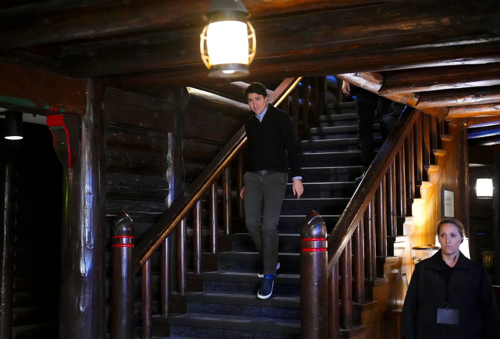 Canadian Prime Minister Justin Trudeau walks down stairs during a cabinet retreat at Chateau Montebello in Montebello, Quebec, Monday, Jan. 20, 2025. (Sean Kilpatrick/The Canadian Press via AP)