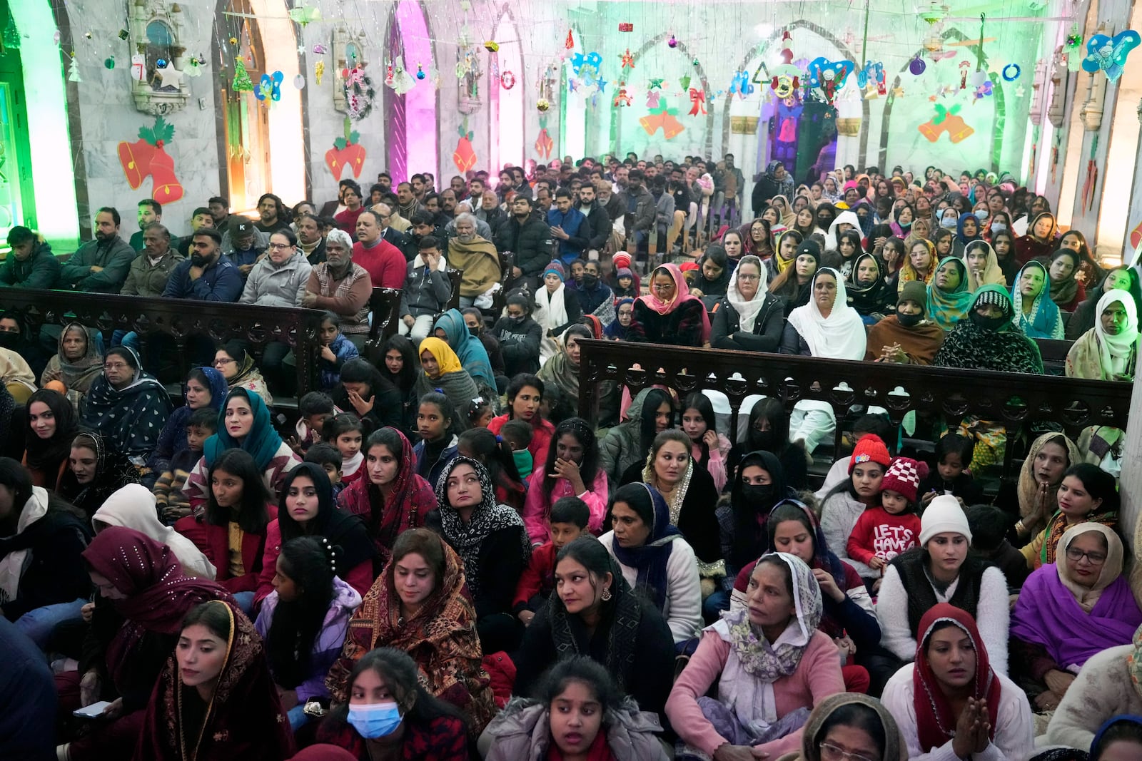 Pakistani Christians attend midnight Christmas Mass at St. Anthony's church in Lahore, Pakistan, Wednesday, Dec. 25, 2024. (AP Photo/K.M. Chaudary)