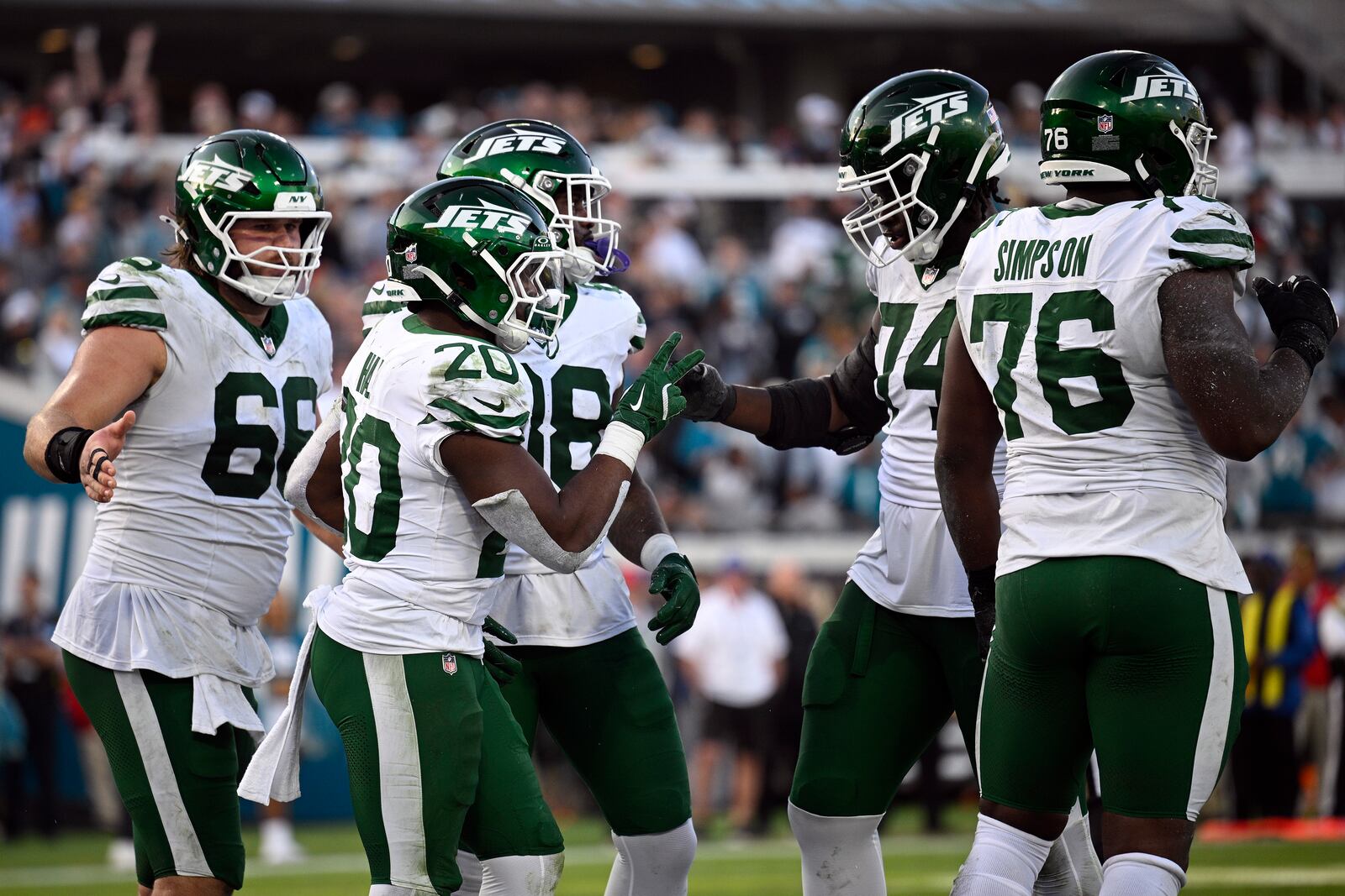 New York Jets running back Breece Hall (20) celebrates his touchdown against the Jacksonville Jaguars during the second half of an NFL football game Sunday, Dec. 15, 2024, in Jacksonville, Fla. (AP Photo/Phelan M. Ebenhack)