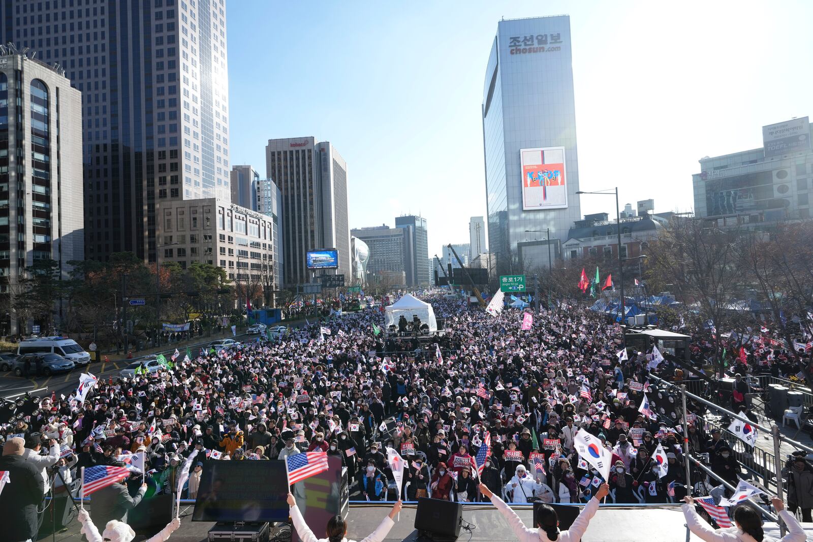 People gather during a rally held by conservative groups supporting South Korean President Yoon Suk Yeol and denouncing opposition parties' lawmakers who demanding impeachment of the president, in Seoul, South Korea, Saturday, Dec. 7, 2024, following the president's short-lived martial law declaration. (AP Photo/Lee Jin-man)