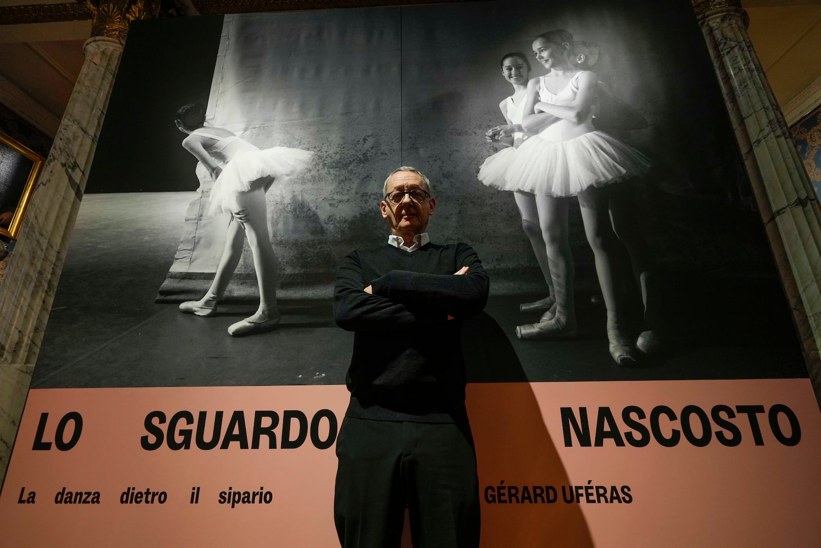 Photographer Gerard Uferas poses during the unveiling of the photo exhibition 'Lo sguardo nascosto' ( The hidden gaze), at the La Scala Opera House in Milan, Italy, Tuesday, Feb. 11, 2025. (AP Photo/Luca Bruno)