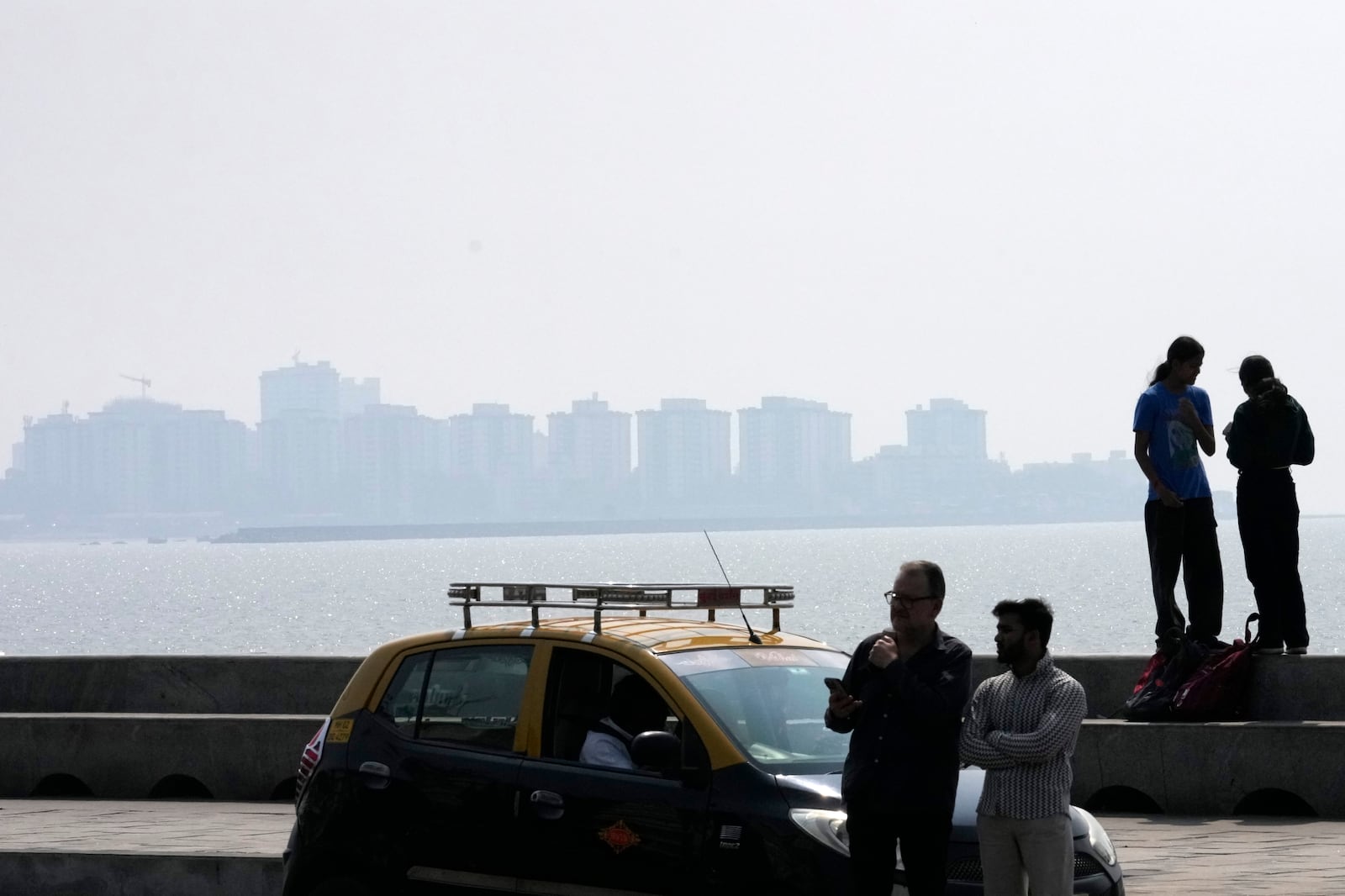 A thick layer of smog covers the skyline in Mumbai, India, on Feb. 10, 2025. (AP Photo/Rajanish Kakade)