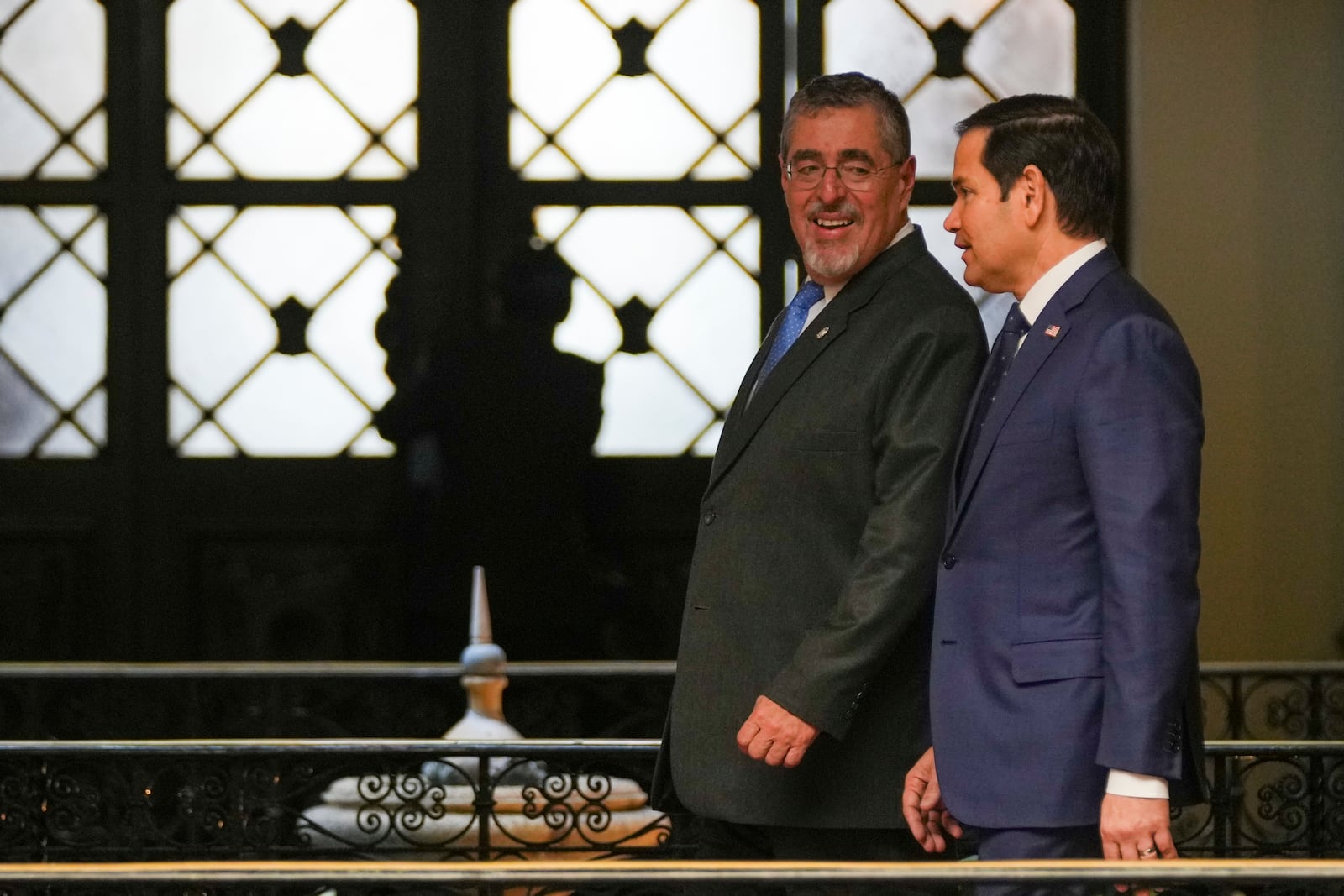 U.S. Secretary of State Marco Rubio, right, and Guatemalan President Bernardo Arevalo arrive to give a joint press conference at the National Palace in Guatemala City, Wednesday, Feb. 5, 2025. (AP Photo/Moises Castillo)