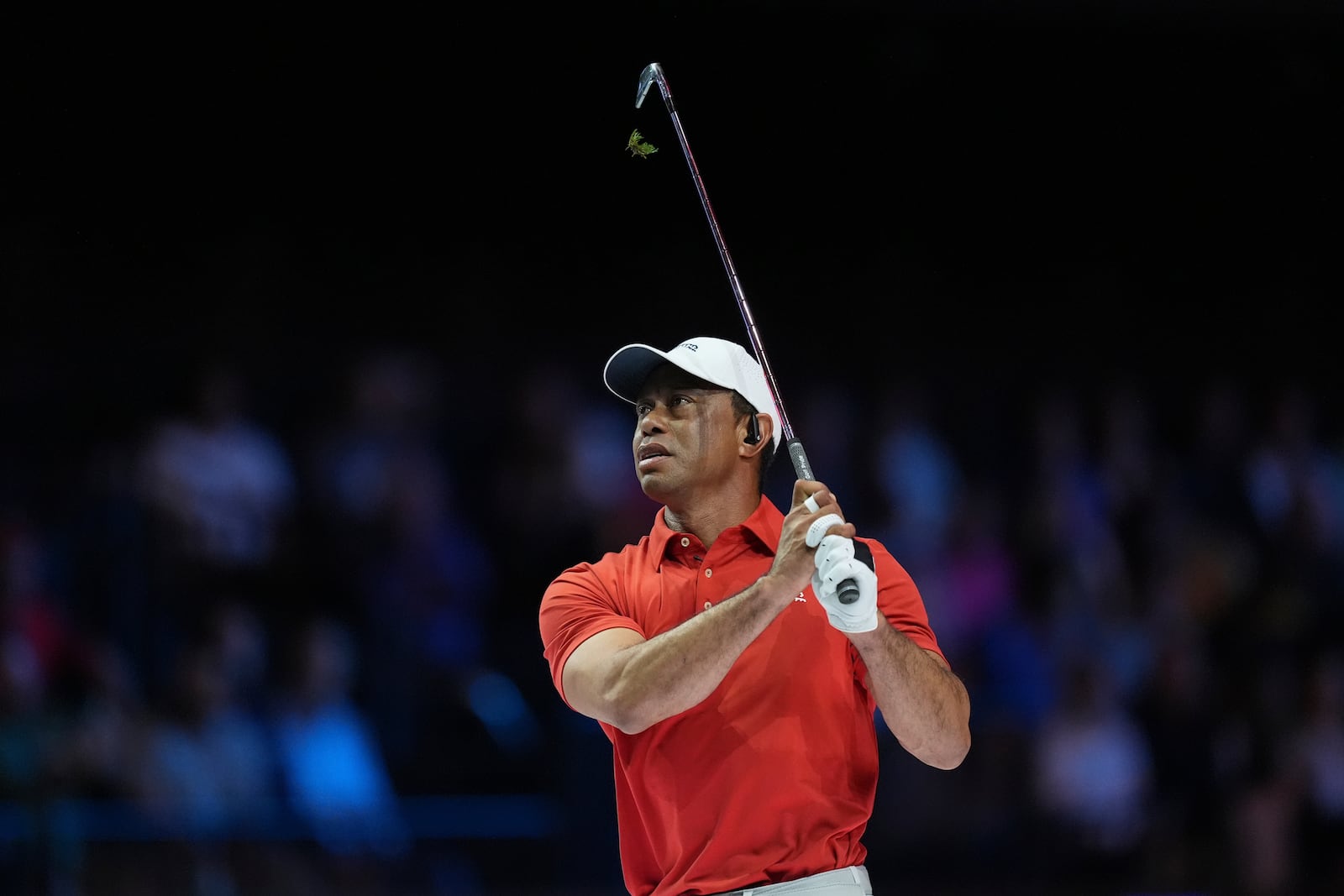 Tiger Woods of Jupiter Links Golf Club watches a shot during a match of the TMRW Golf League (TGL) against Boston Common Golf, Monday, Jan. 27, 2025, in Palm Beach Gardens, Fla. (AP Photo/Rebecca Blackwell)