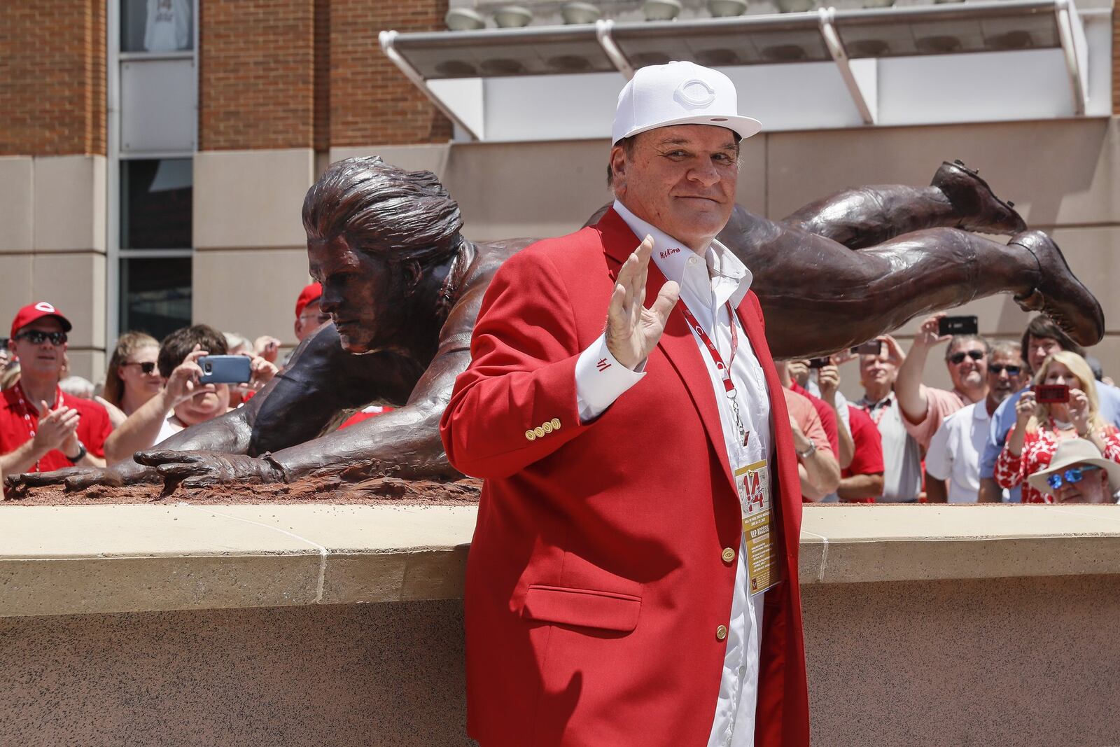 Former Cincinnati Reds player Pete Rose smiles as he stands for pictures during the dedication of his statue outside Great American Ballpark prior to a baseball game between the Cincinnati Reds and the Los Angeles Dodgers, Saturday, June 17, 2017, in Cincinnati. (AP Photo/John Minchillo)