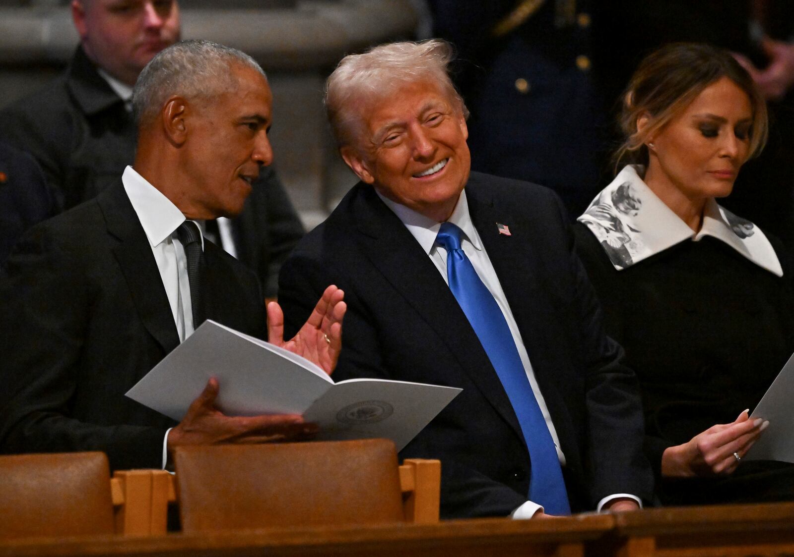 Former President Barack Obama, from left, speaks with President-elect Donald Trump as his wife Melania Trump looks on before the casket of former President Jimmy Carter arrives for a state funeral at the National Cathedral, Thursday, Jan. 9, 2025, in Washington. (Ricky Carioti/The Washington Post via AP, Pool)