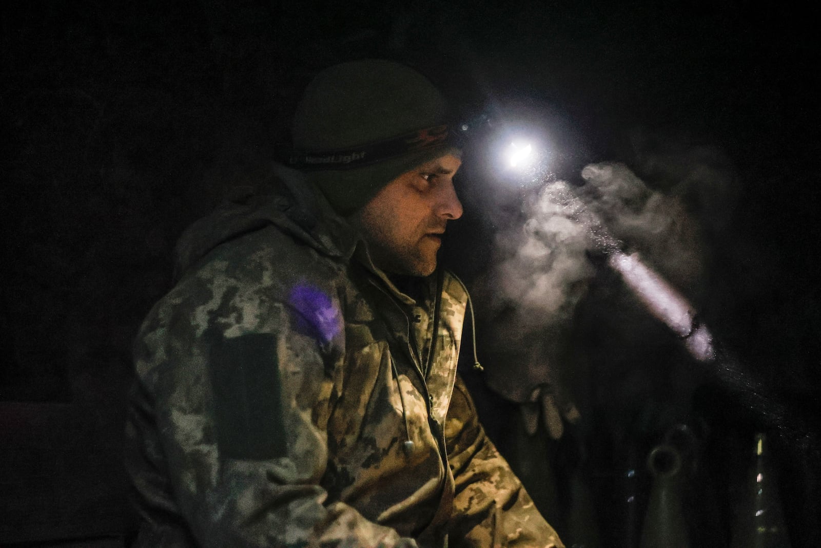 A Ukrainian serviceman sits in a shelter on his position at the frontline near Donetsk, Ukraine, Monday, March 3, 2025. (AP Photo/Roman Chop)