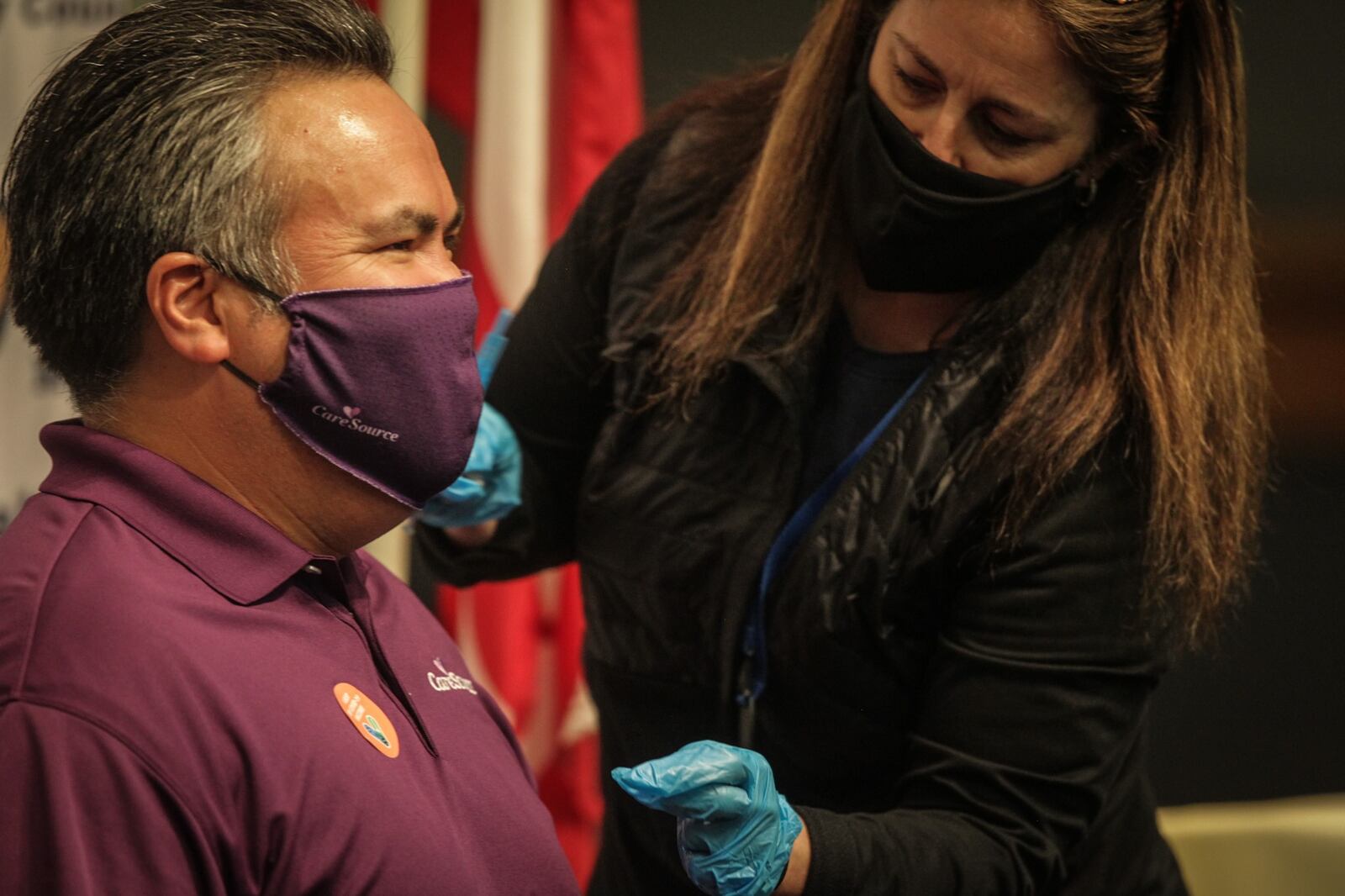 Erhardt Preitauer, president and chief executive of CareSource of Dayton,  gets his second COVID-19 vaccine at the Dayton Convention Convention Center on Thursday, April 8, 2021. The company is encouraging employees to get vaccinated.