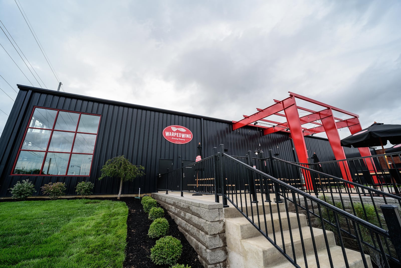 The patio at Warped Wing Barrel Room & Smokery in Springboro. TOM GILLIAM/CONTRIBUTING PHOTOGRAPHER