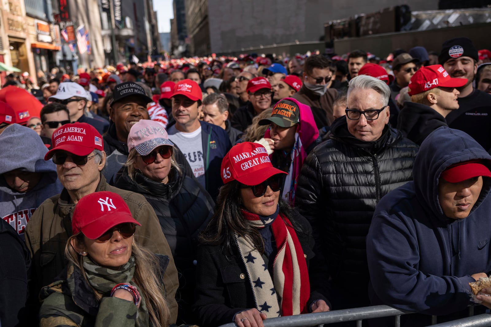 Supporters of Republican presidential nominee former President Donald Trump gather for his campaign rally outside Madison Square Garden, Sunday, Oct. 27, 2024, in New York. (AP Photo/Yuki Iwamura)