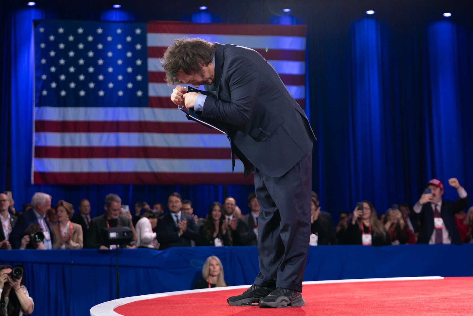 Argentina's President Javier Milei bows to the crowd before speaking at the Conservative Political Action Conference, CPAC, at the Gaylord National Resort & Convention Center, Saturday, Feb. 22, 2025, in Oxon Hill, Md. (AP Photo/Jose Luis Magana)